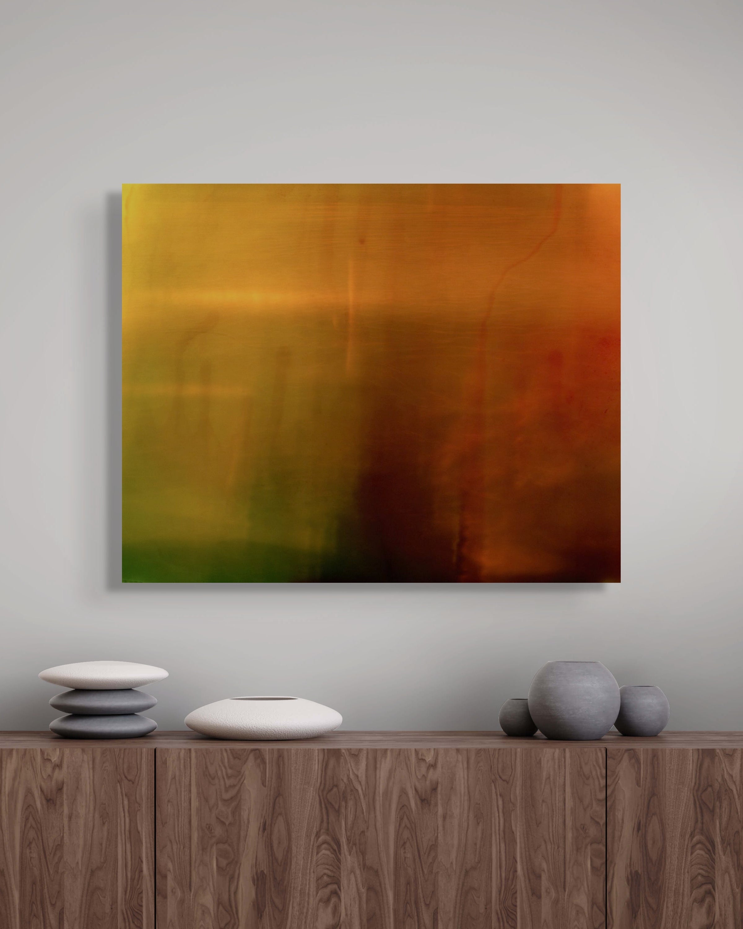 Dithering I metal print by Marcus Reistad hanging above a modern walnut sideboard with sculptural ceramic decor.