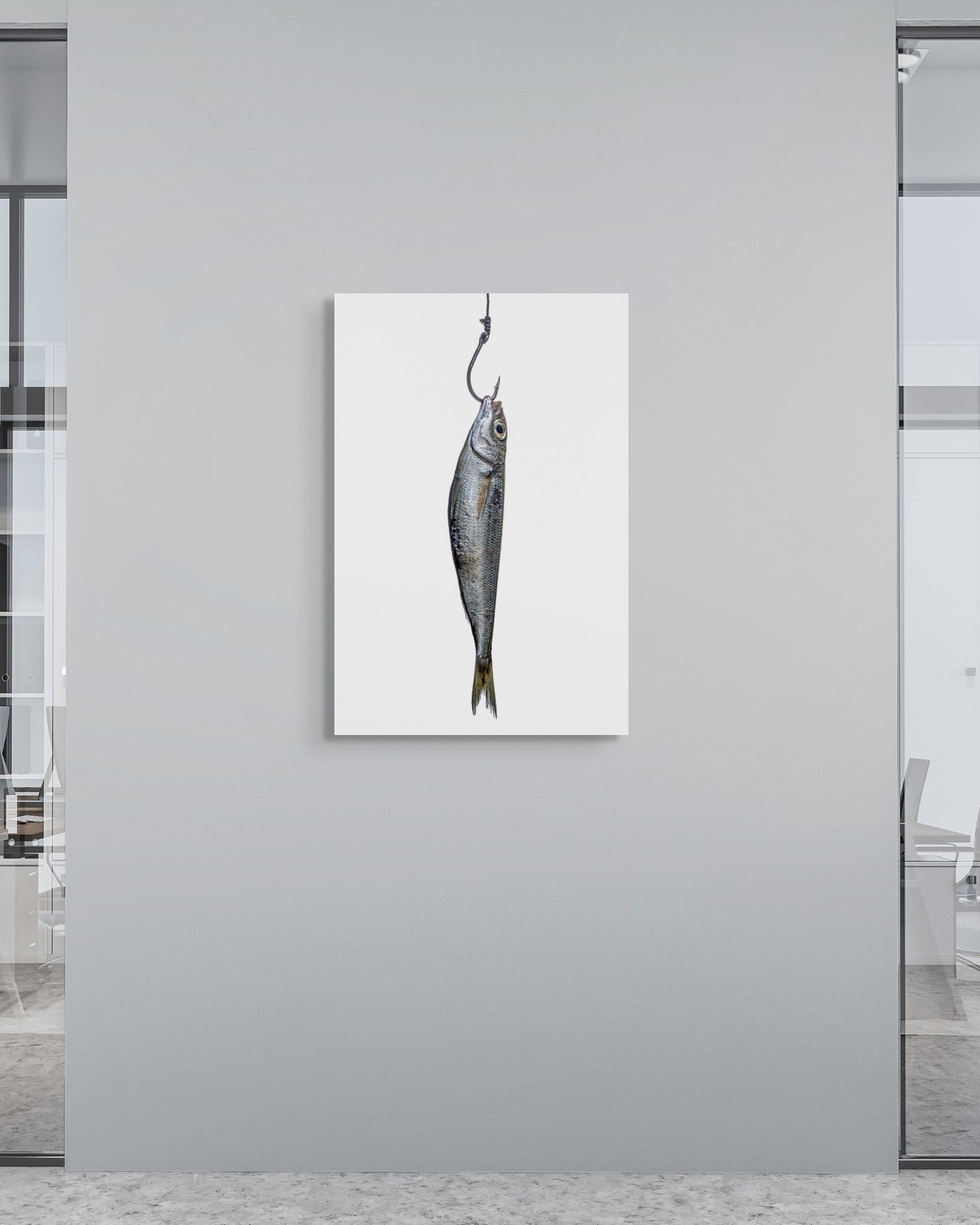 Modern office interior with a fish artwork on a gray wall.