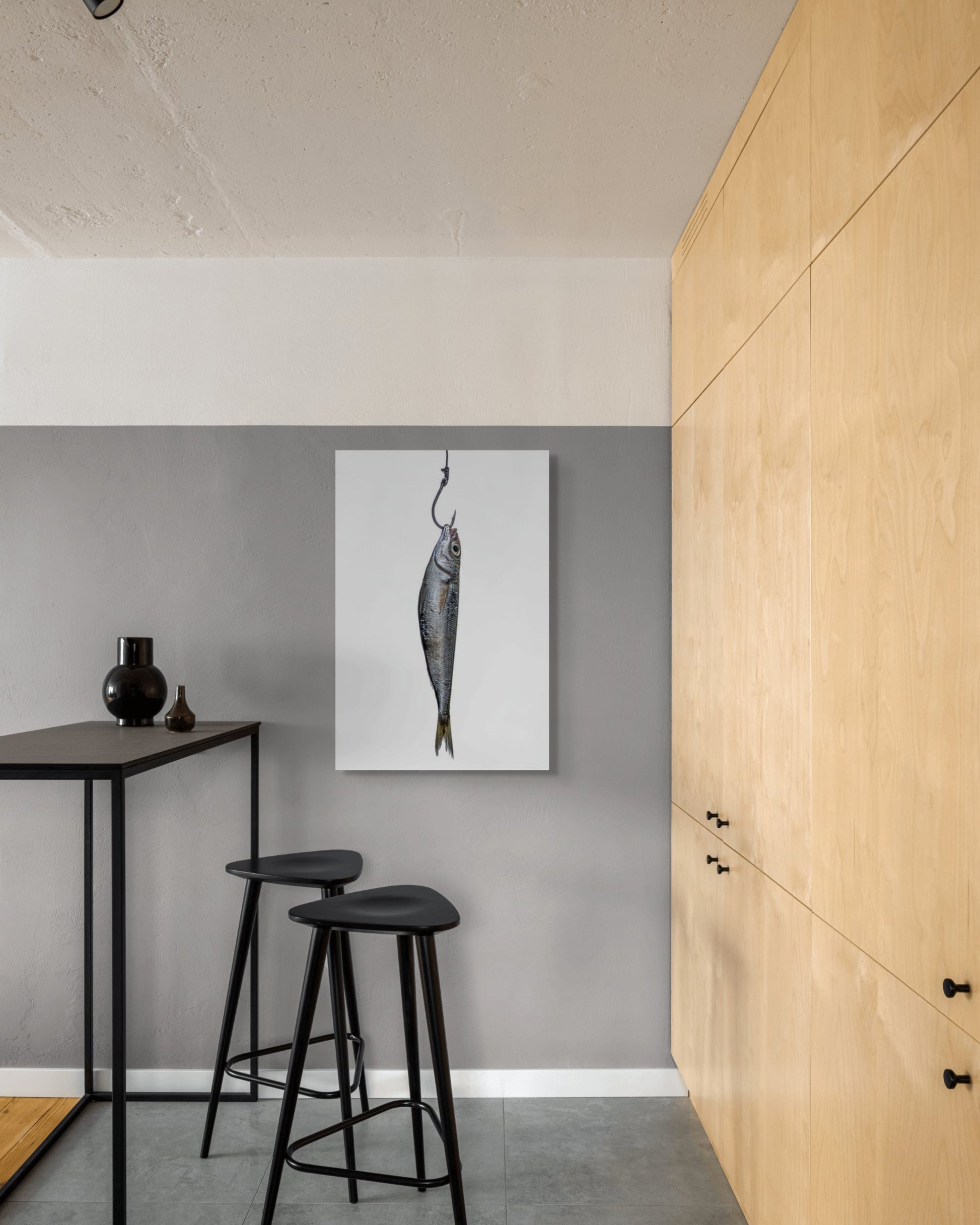 Framed and ready to hang fine art print, Anchovy by Sivan Roshianu, displayed in modern kitchen with wooden cabinets.