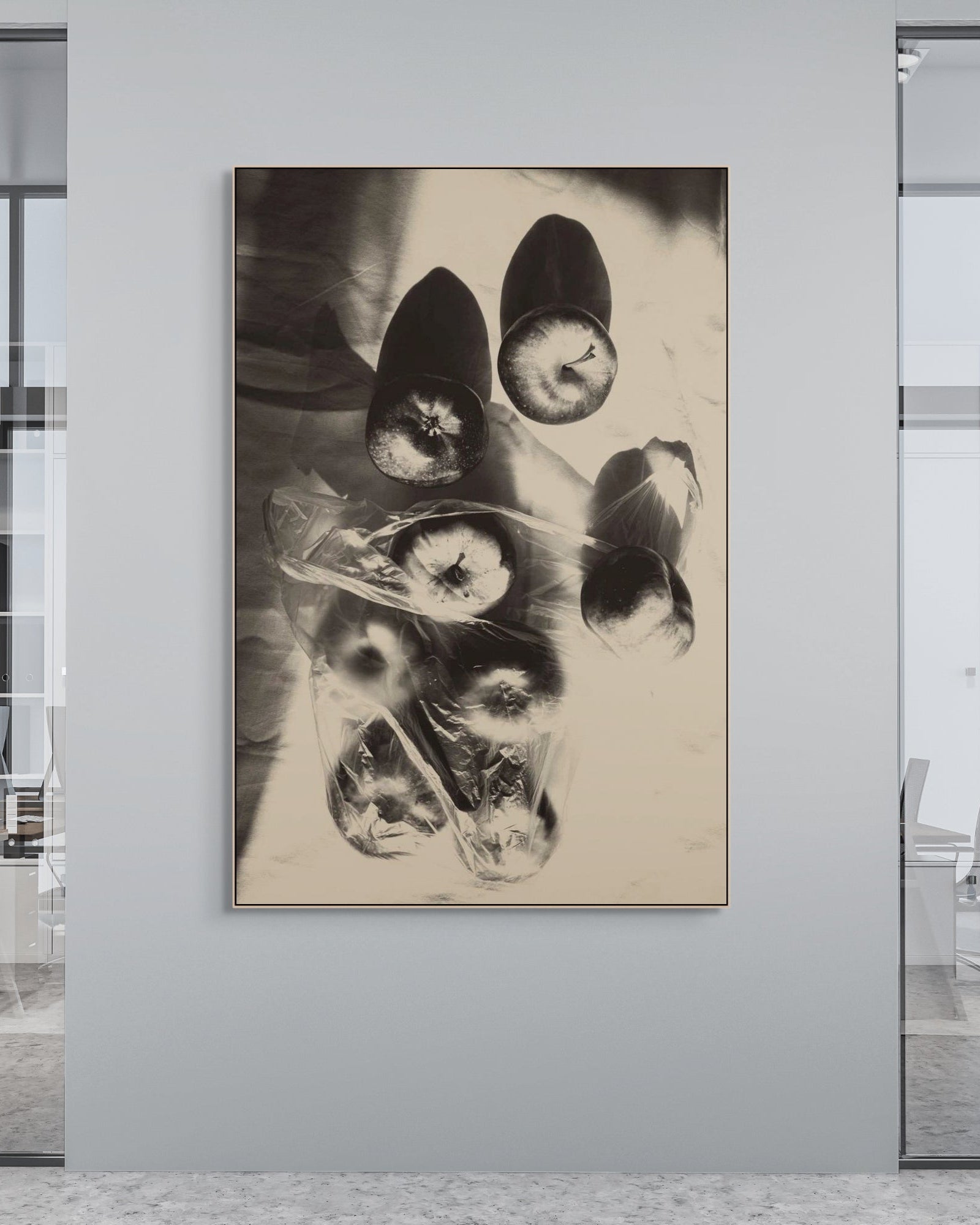 Abstract black and white artwork on a wall in an office setting