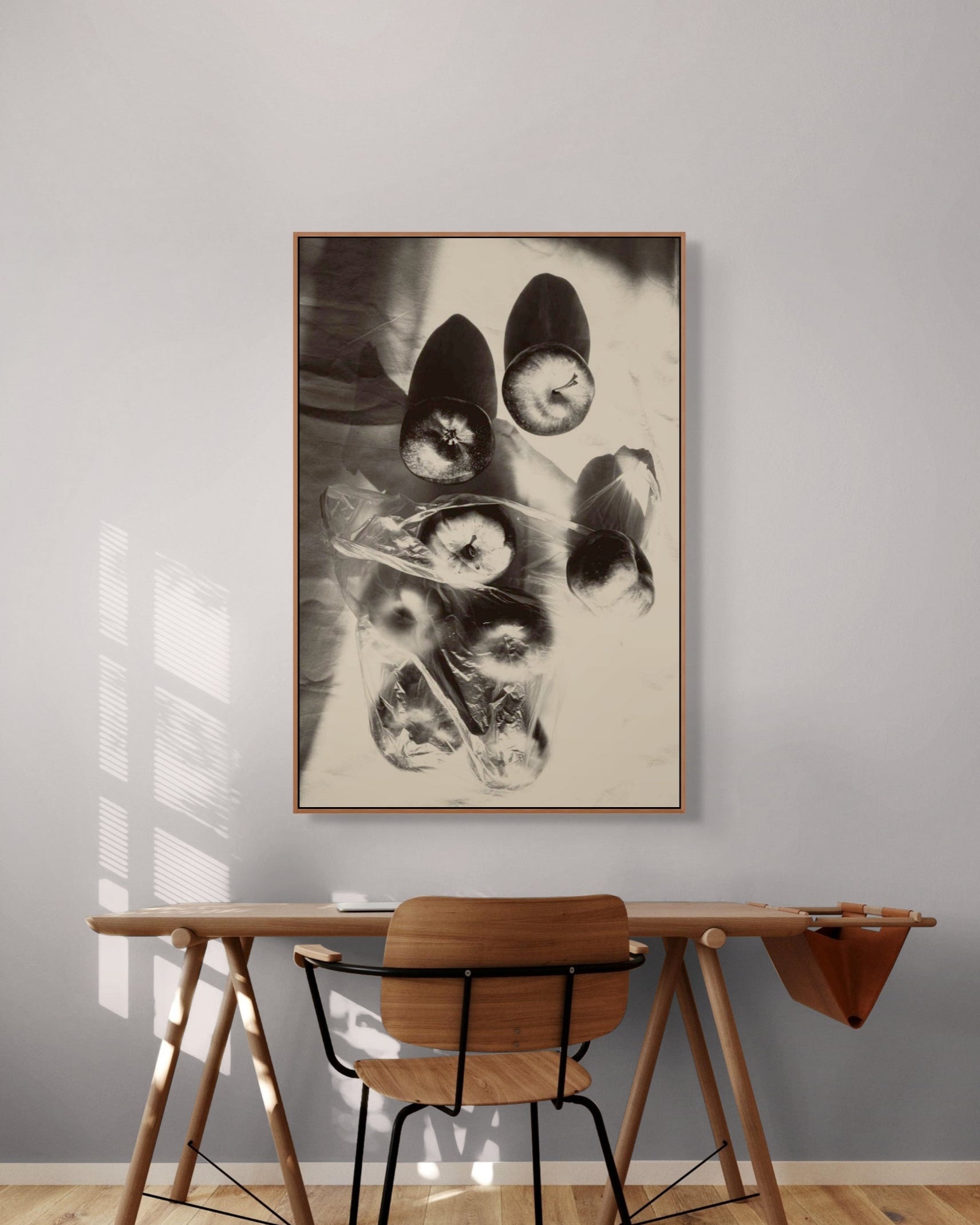 Apples by Jonė Reed - Limited edition fine art photograph, framed black & white print against gray wall