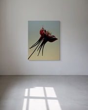 Abstract print of a flower on a white wall