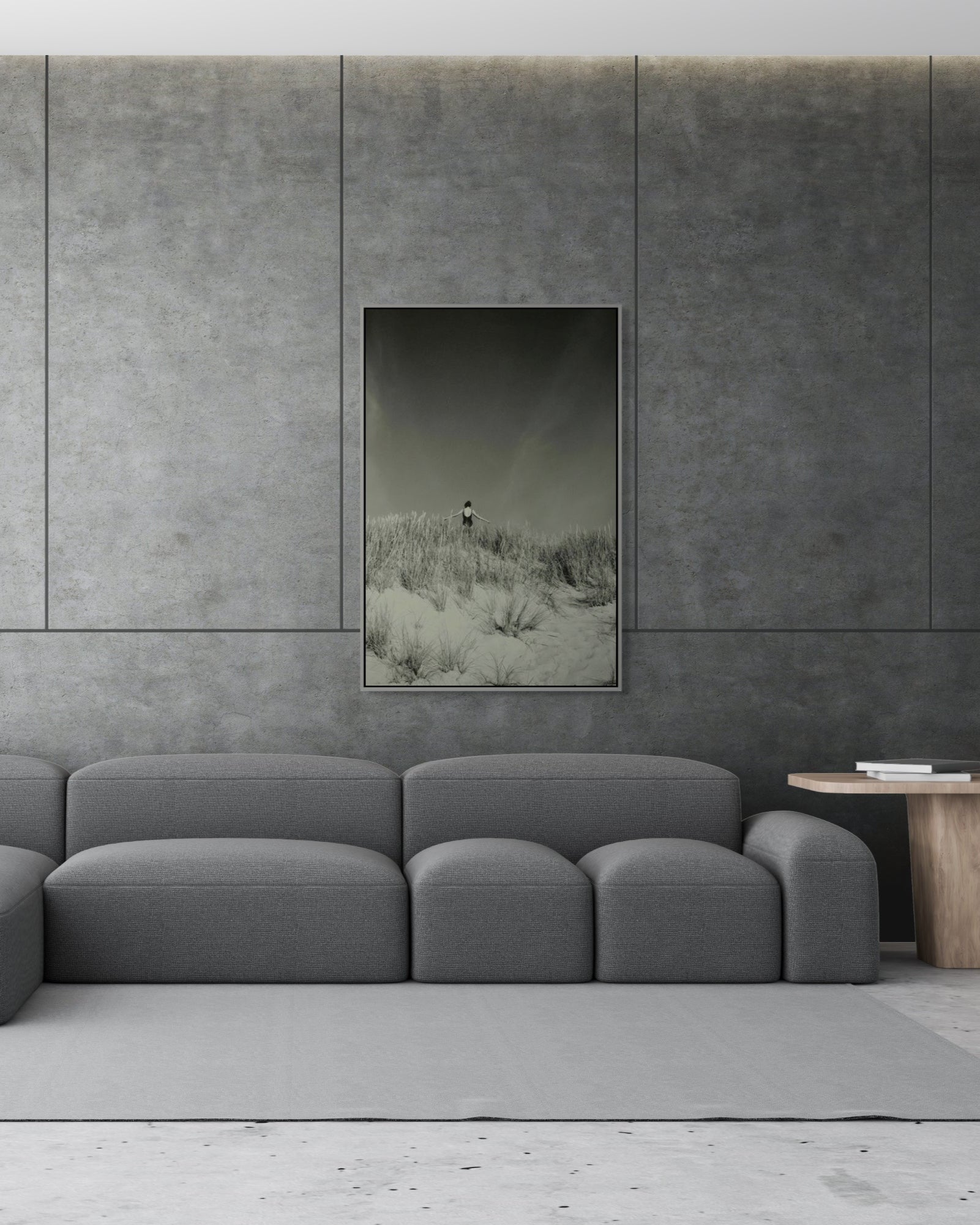 Framed fine art photograph Baltic Dunes by Jonė Reed, displayed in minimalist interior with concrete walls and rug