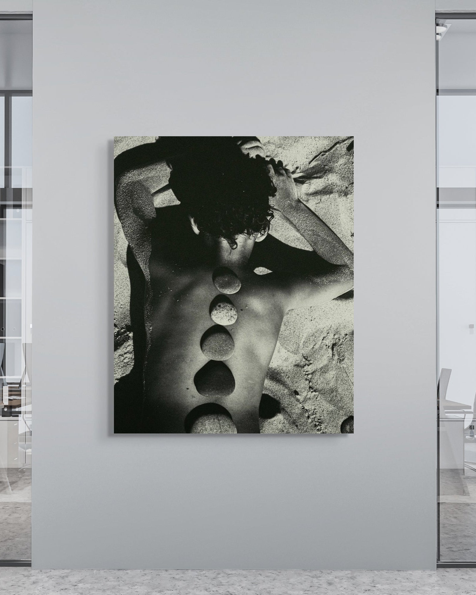 Framed black and white fine art print in modern office space, Baltic Stones by Jonė Reed, ready to hang metal print