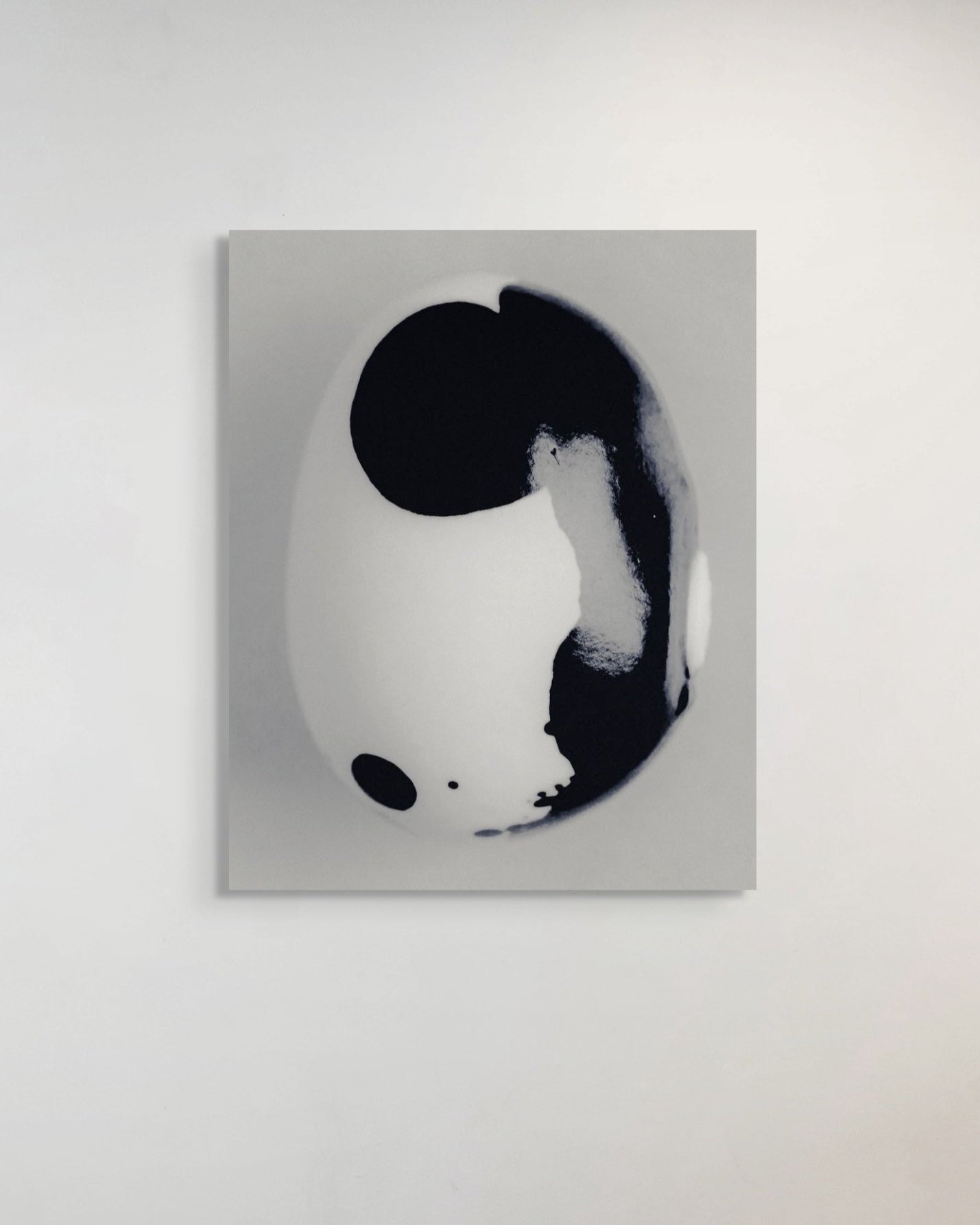 Abstract black and white metal print on a gray background