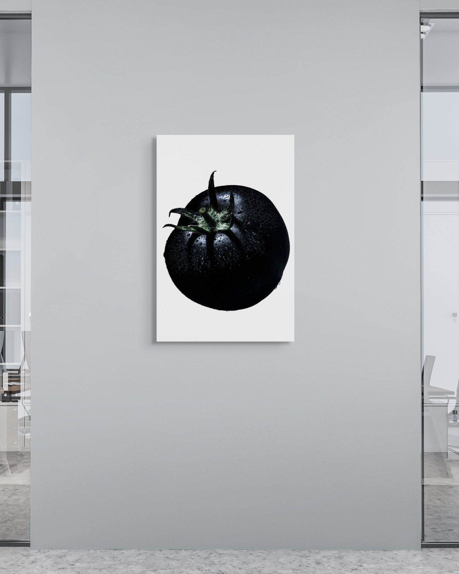 Modern office interior with a black and white abstract metal print on a gray wall.