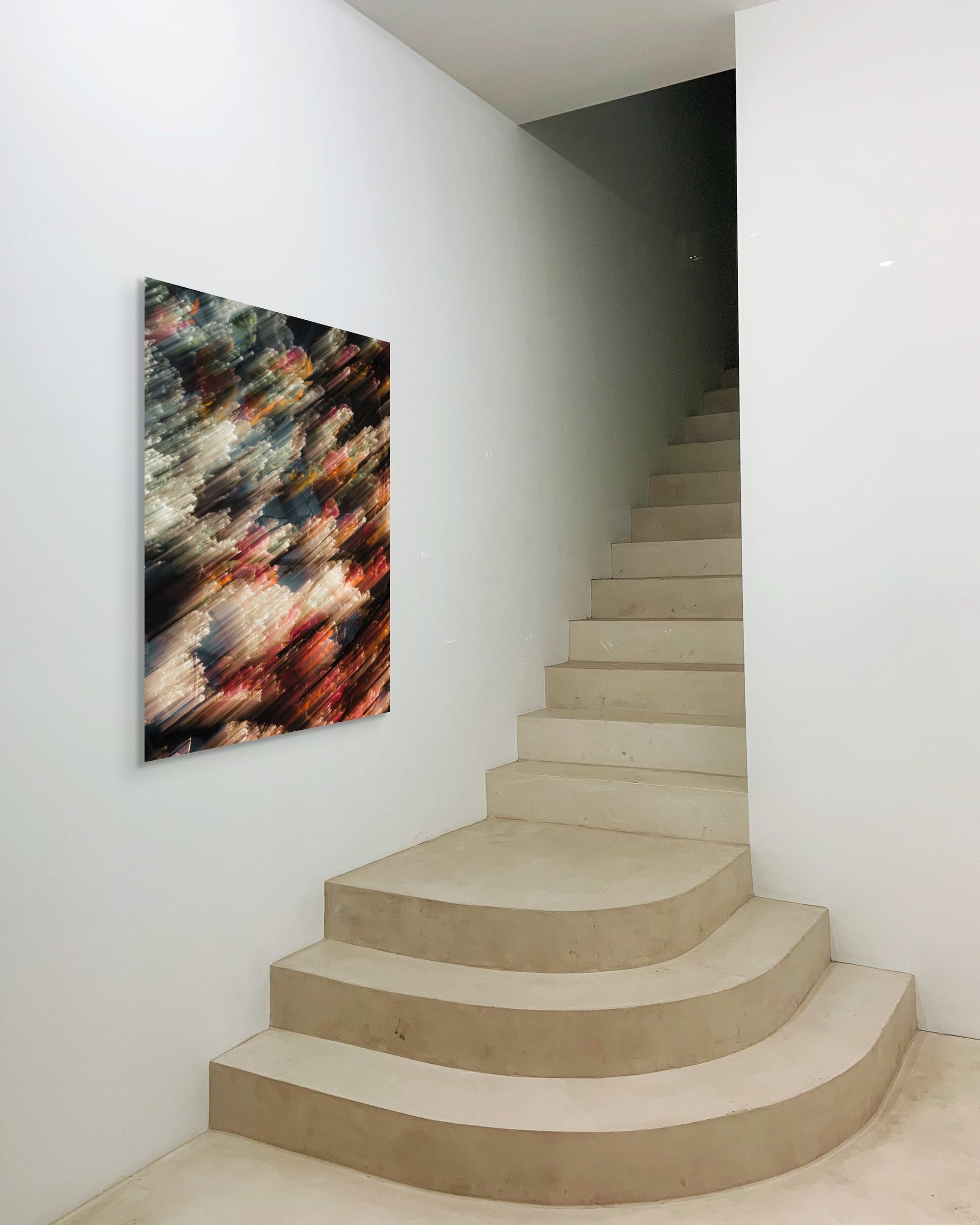 Modern staircase with abstract art on a white wall