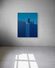 A metal print of “Blueberry II” by Mark Forbes hanging on a light gray wall in a minimalist room, with sunlight casting window shadows across the floor.