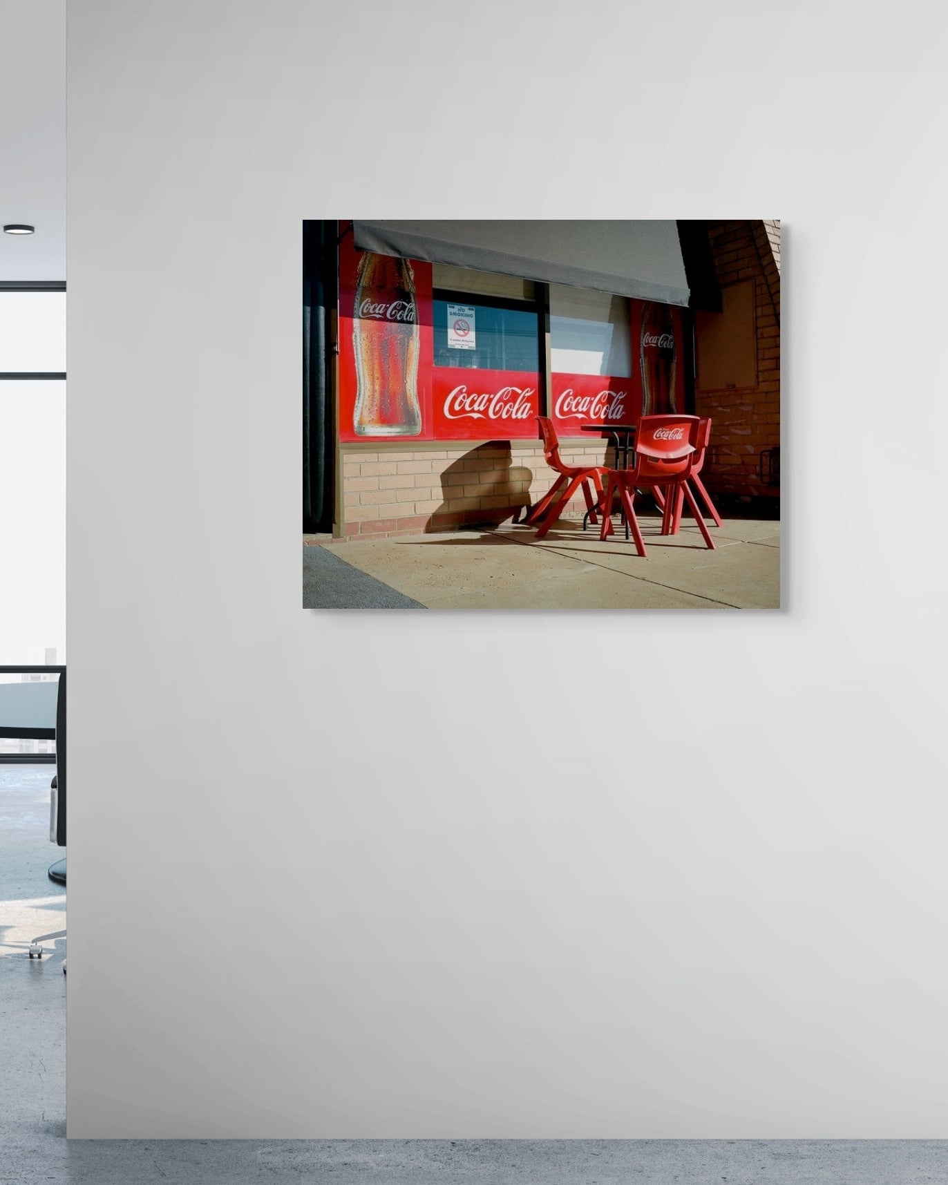 Coca-Cola advertisement on a wall outside a shop