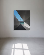 Abstract metal print with geometric shapes on a white wall