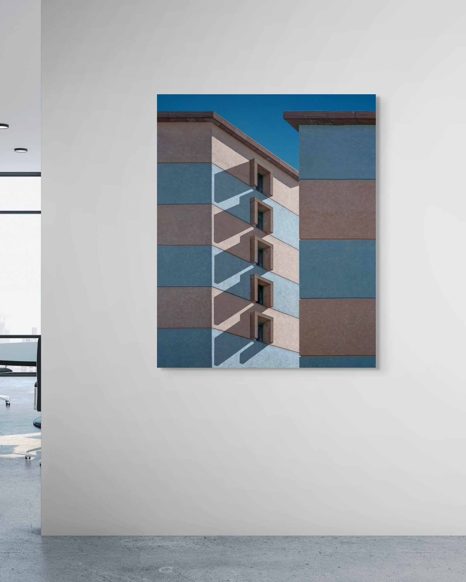 Abstract art piece on a wall in an office setting