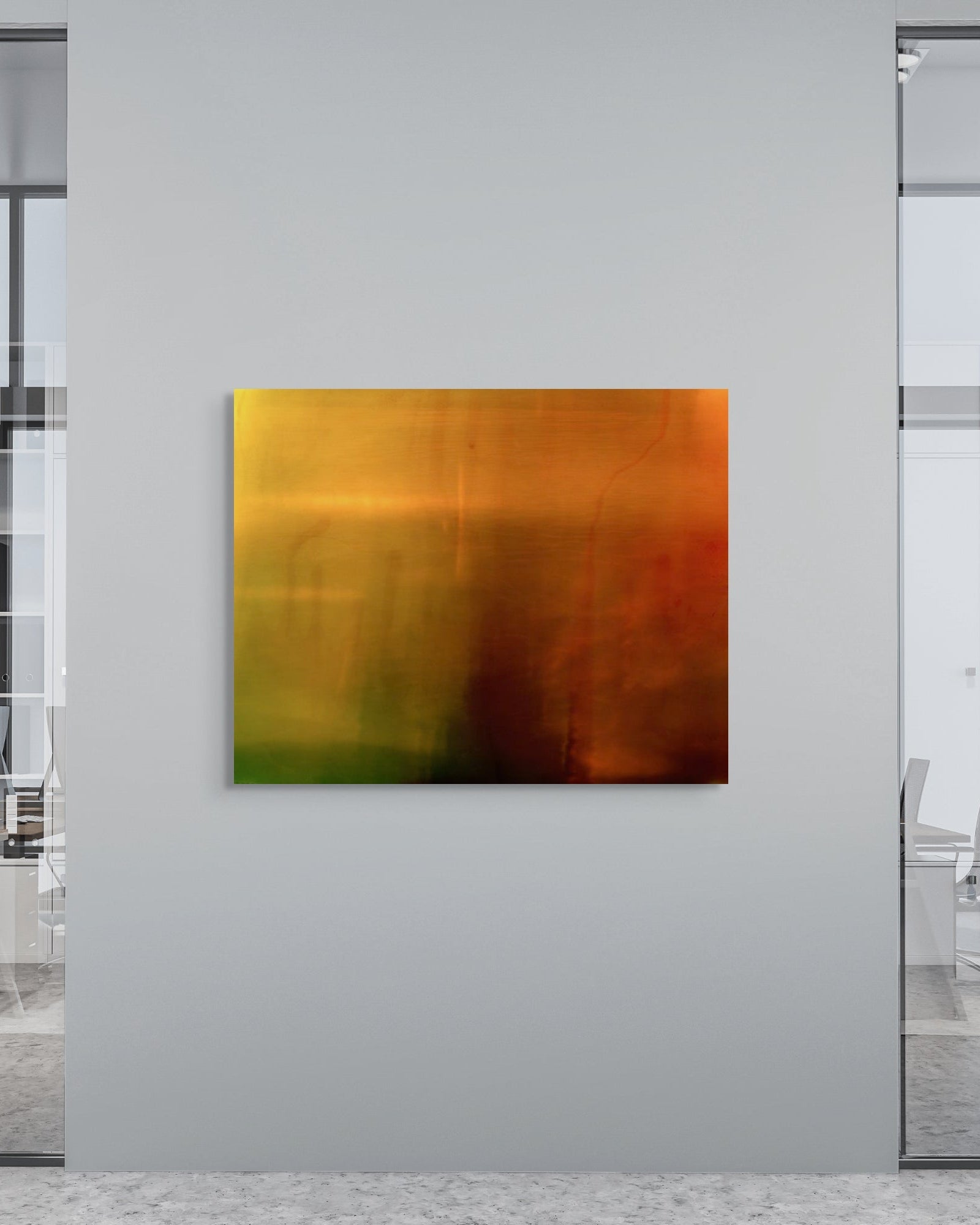 Abstract art piece on a wall in an office setting with glass walls and chairs.