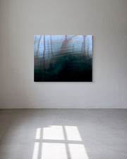 Abstract metal print on a white wall with a reflective floor.