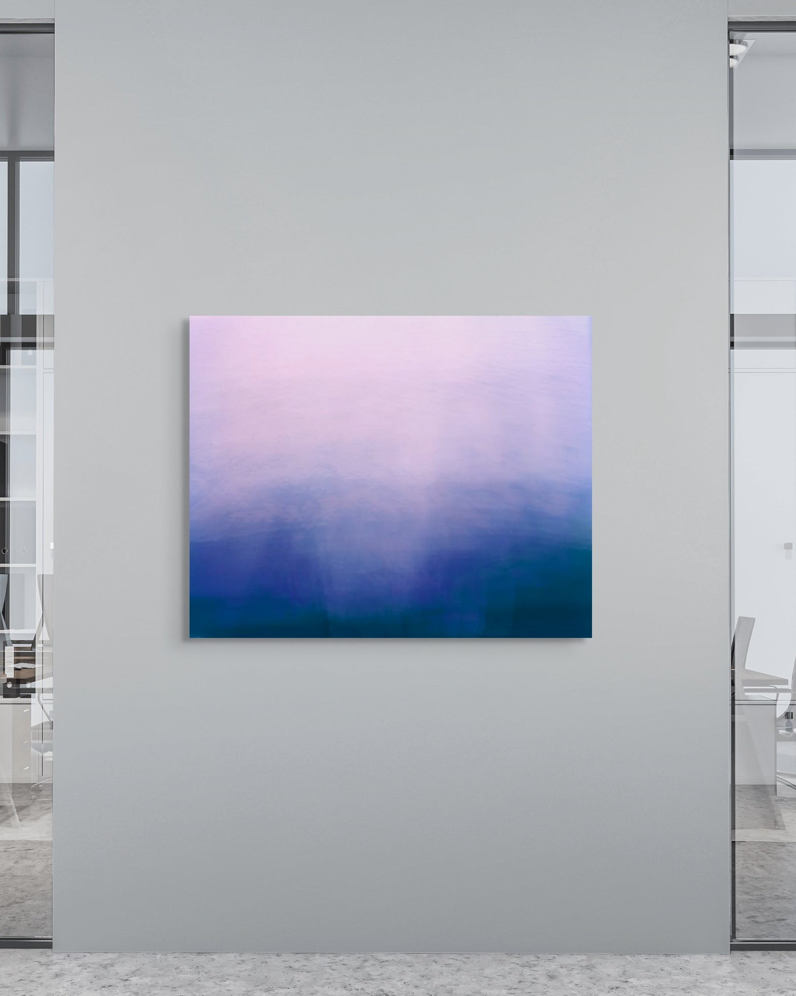 Colorful abstract metal print on a wall in an office setting