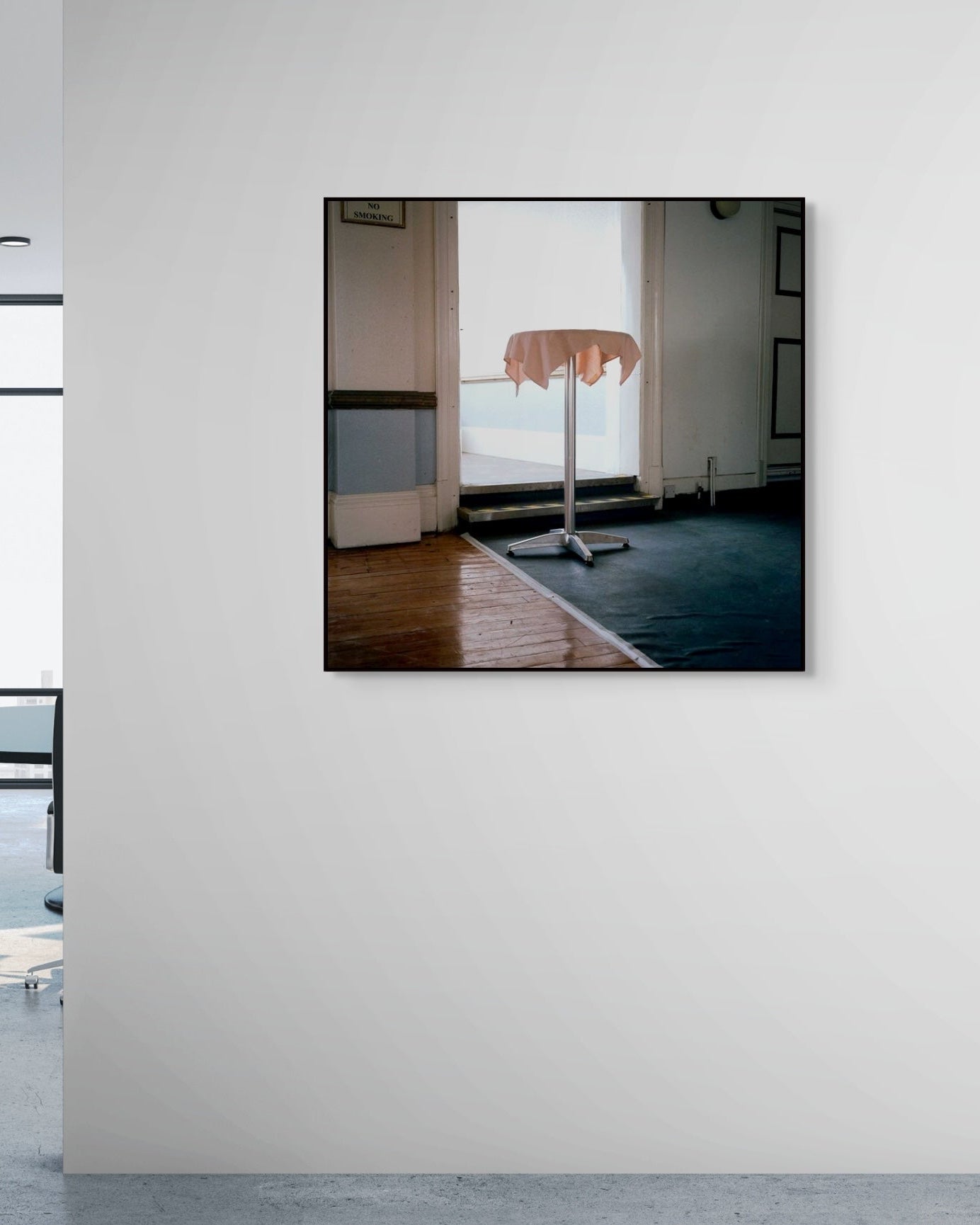 Framed artwork on a wall in an office setting