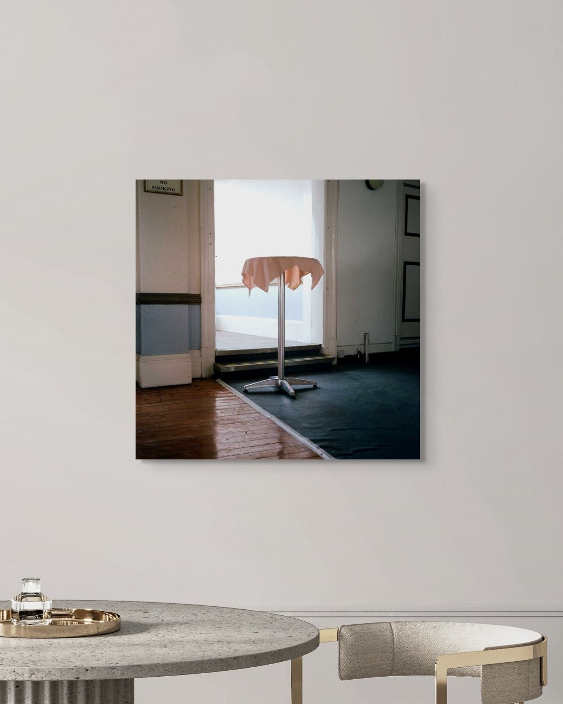 Modern interior design with a metal print reflecting a room with a table.