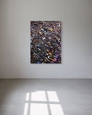 Abstract metal print on a white wall