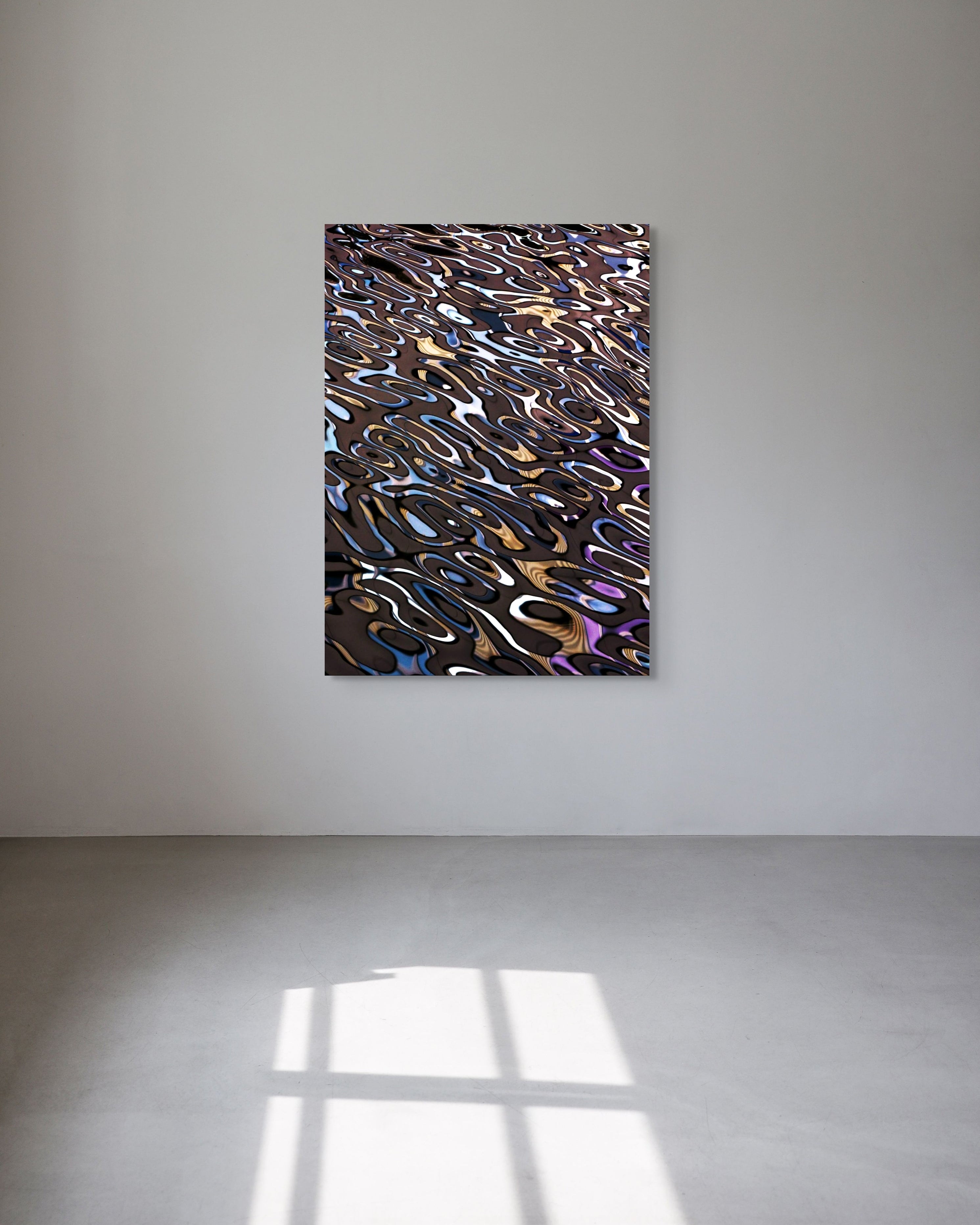 Abstract metal print on a white wall