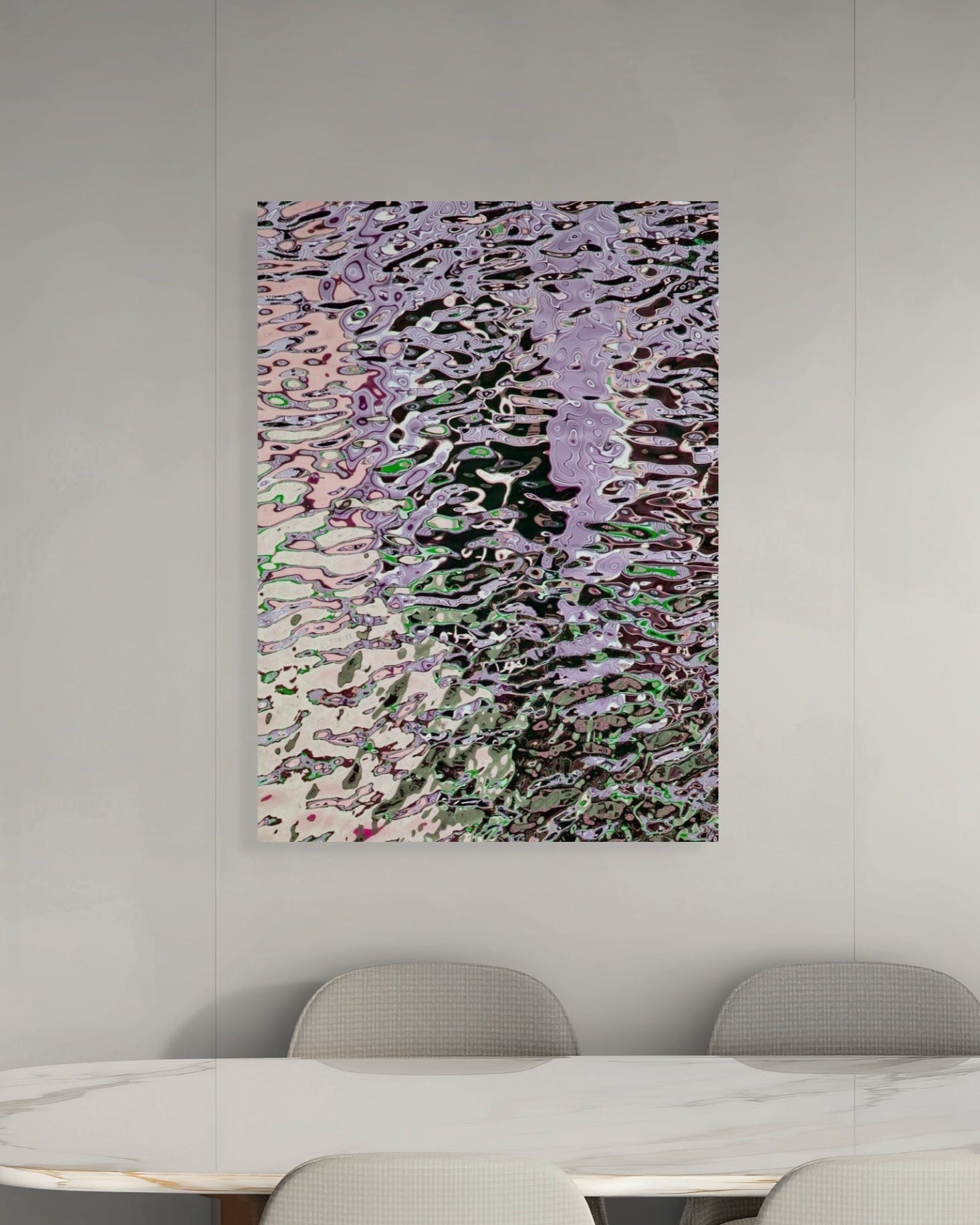 Abstract metal print on a wall above a table and chairs