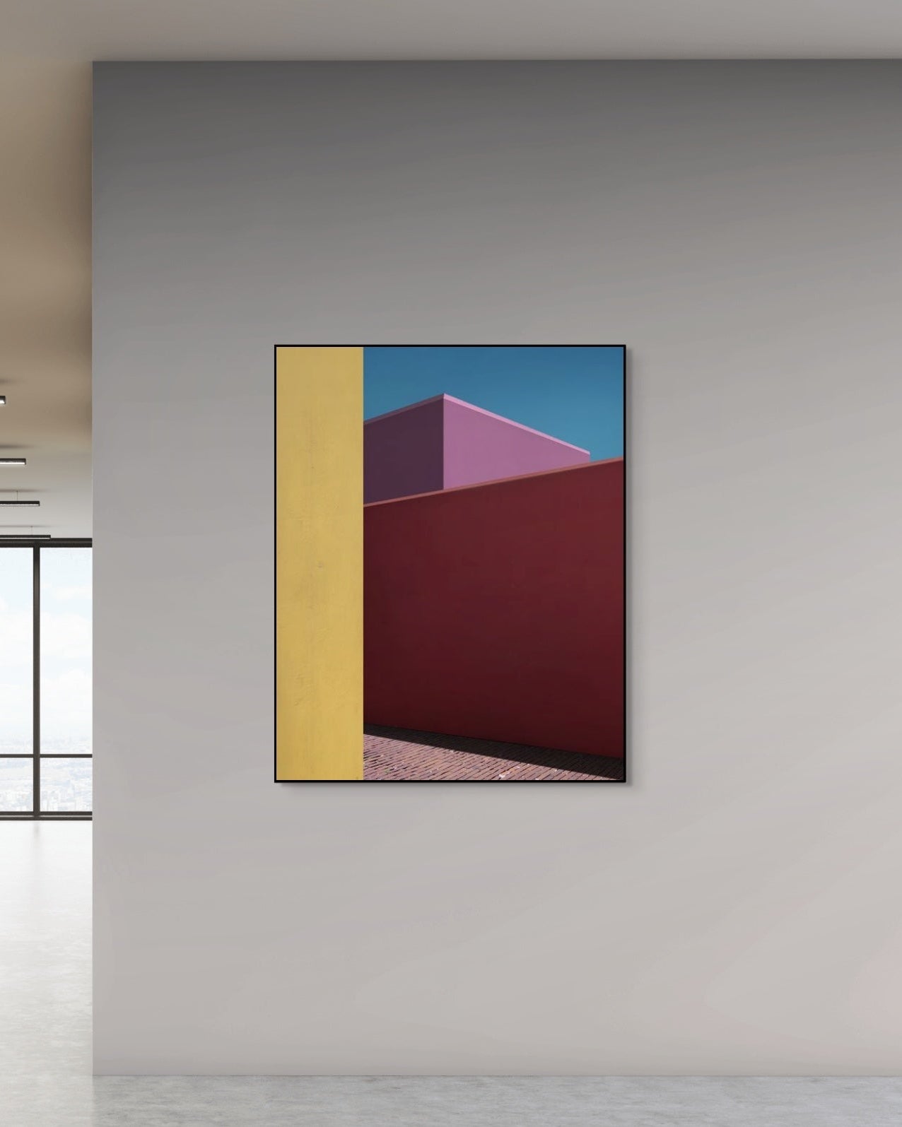 Abstract art piece with geometric shapes on a gray wall