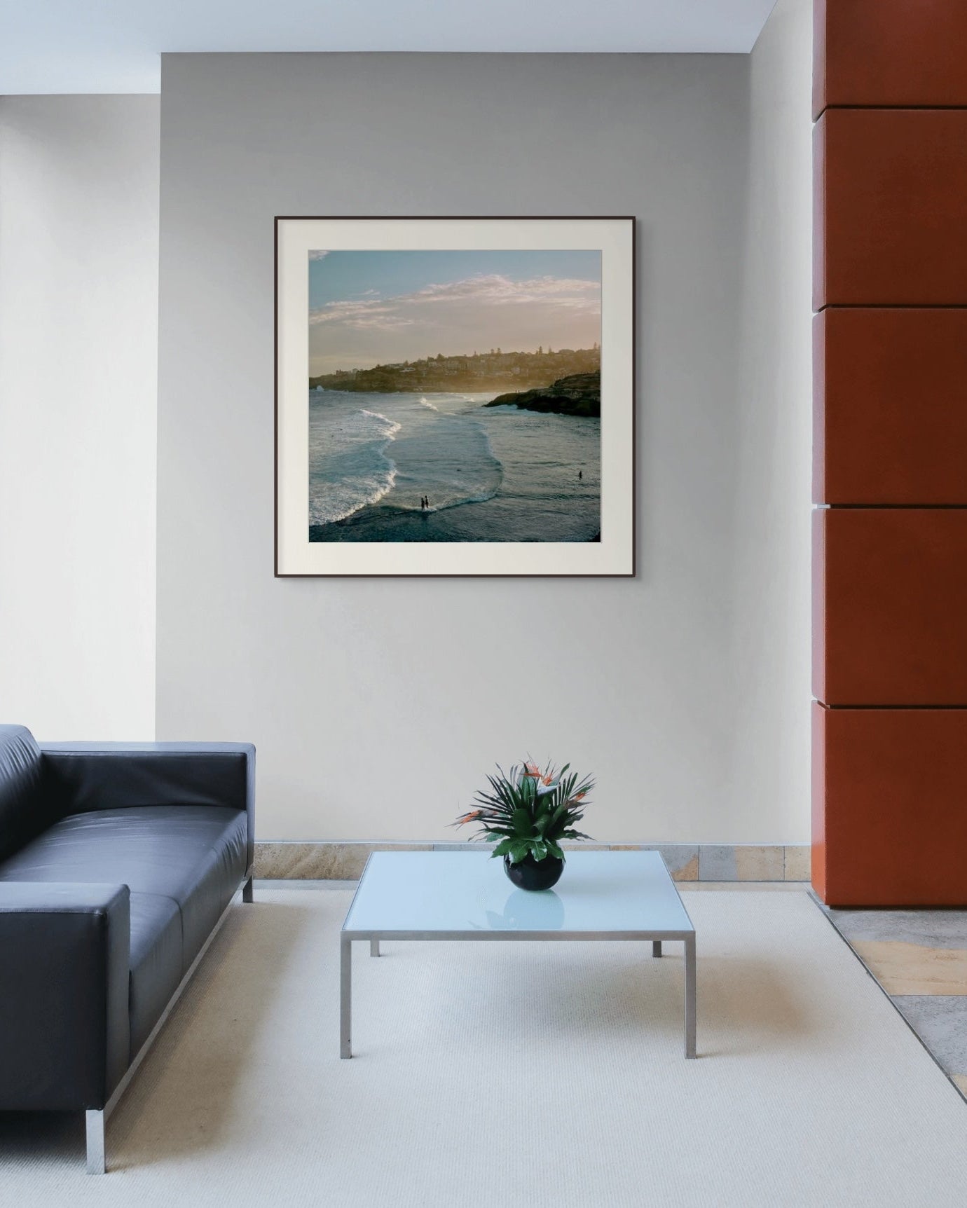 Framed fine art paper print with mat hanging in a modern commercial lobby.