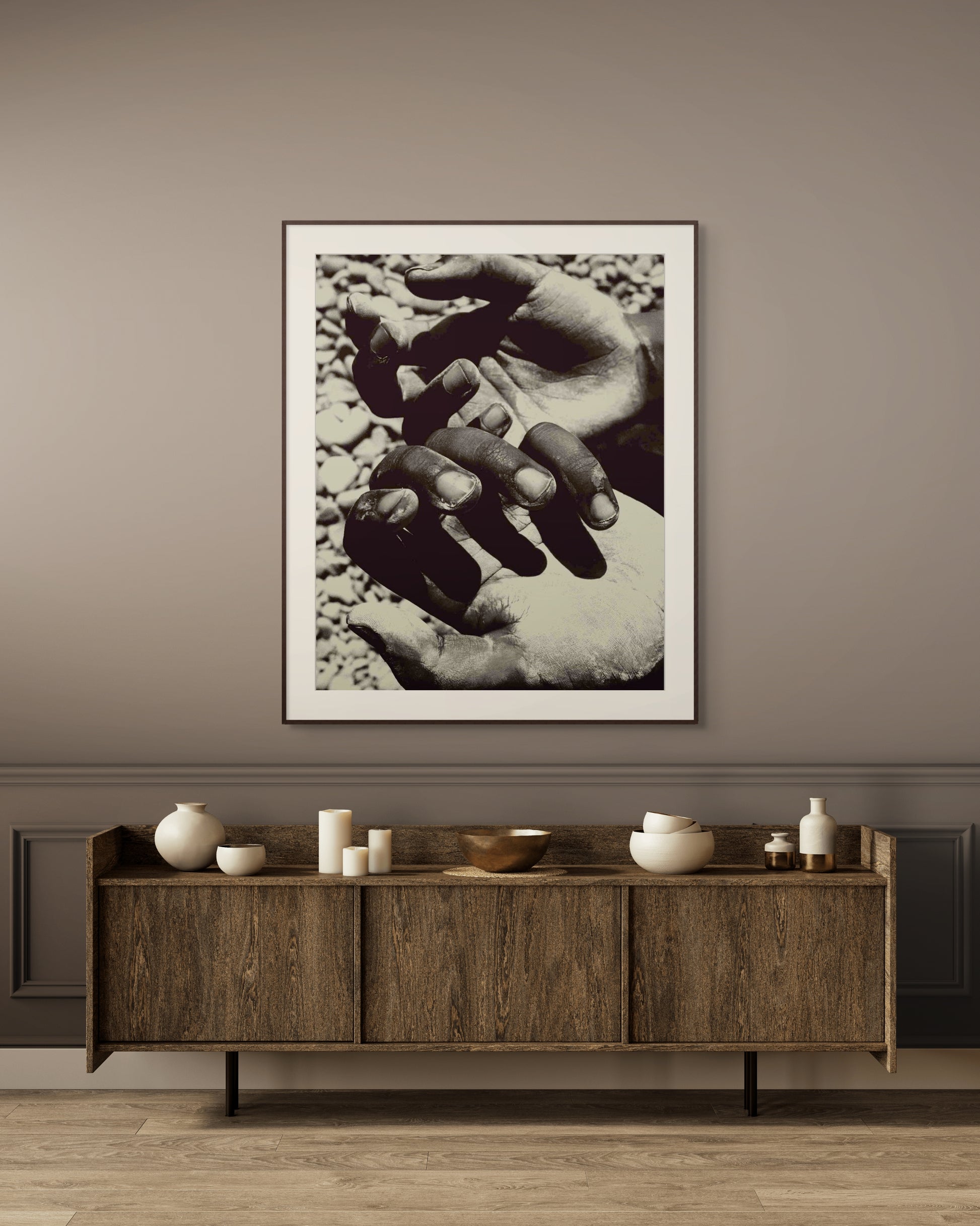 Framed fine art photograph Hands by Jonė Reed, displayed in minimalist interior above sideboard