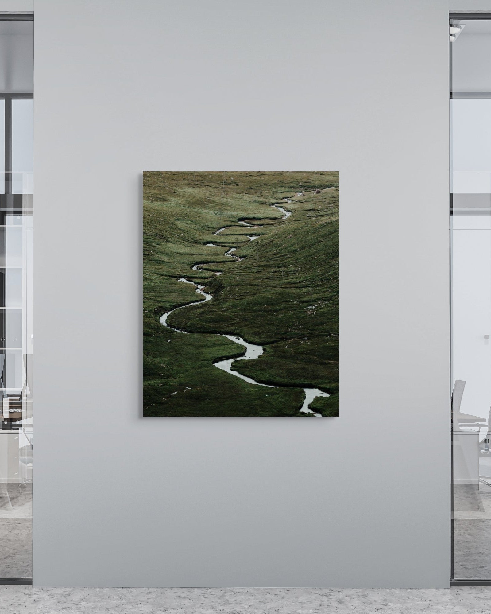 Artistic depiction of a winding river on a wall in an office setting