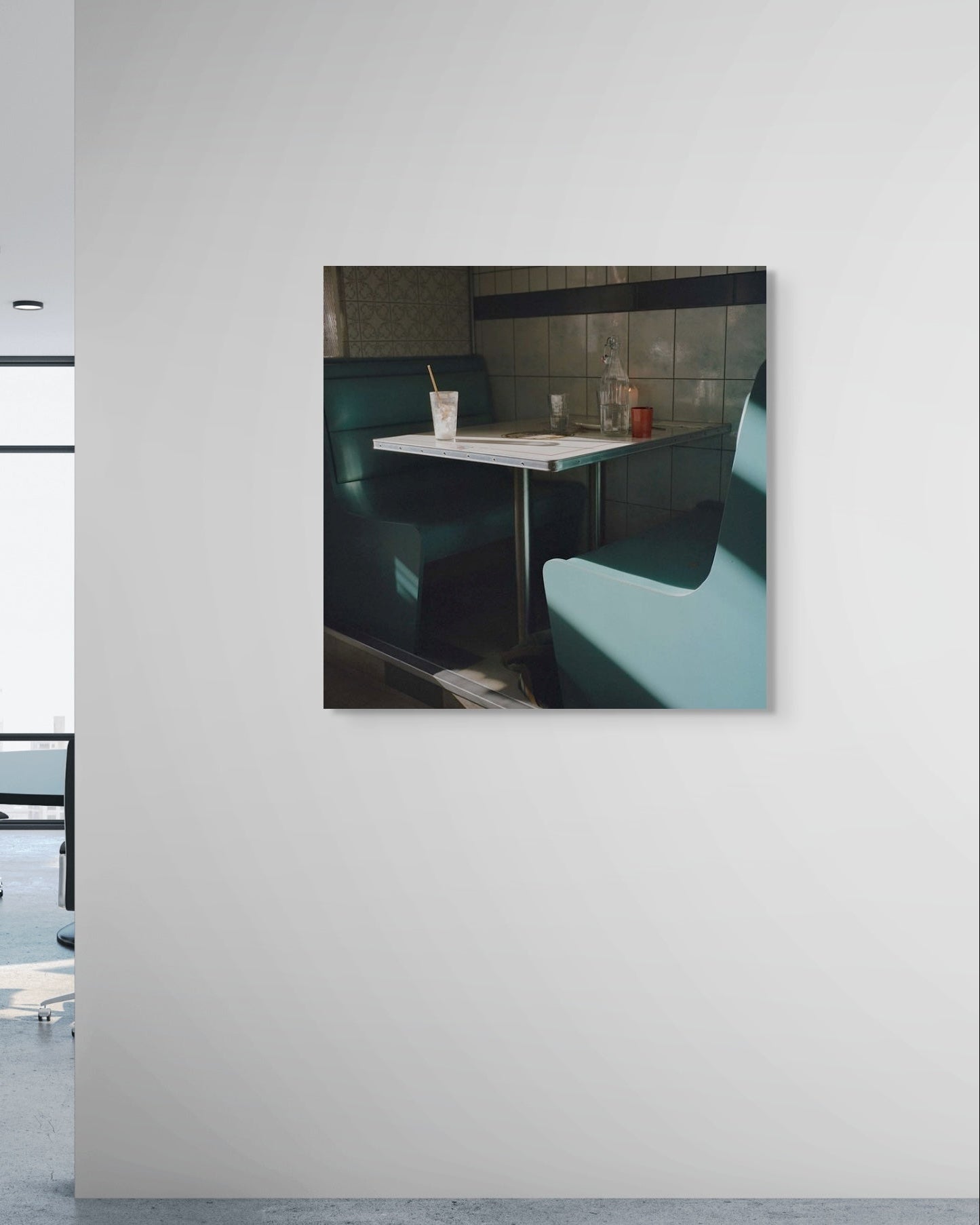 Framed photograph of a restaurant interior on a white wall