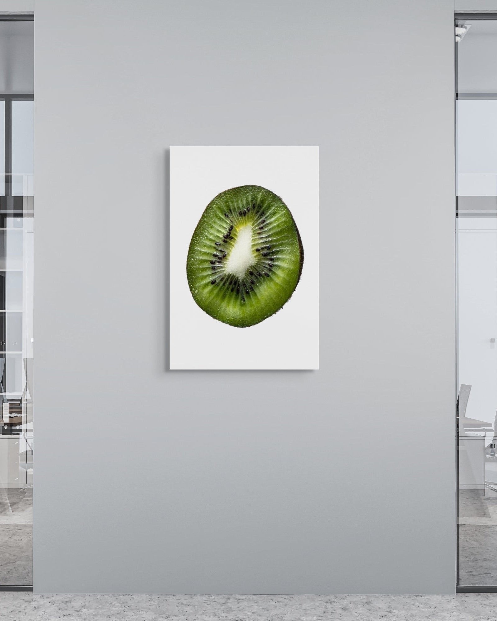 Framed artwork of a kiwi on a wall in an office setting
