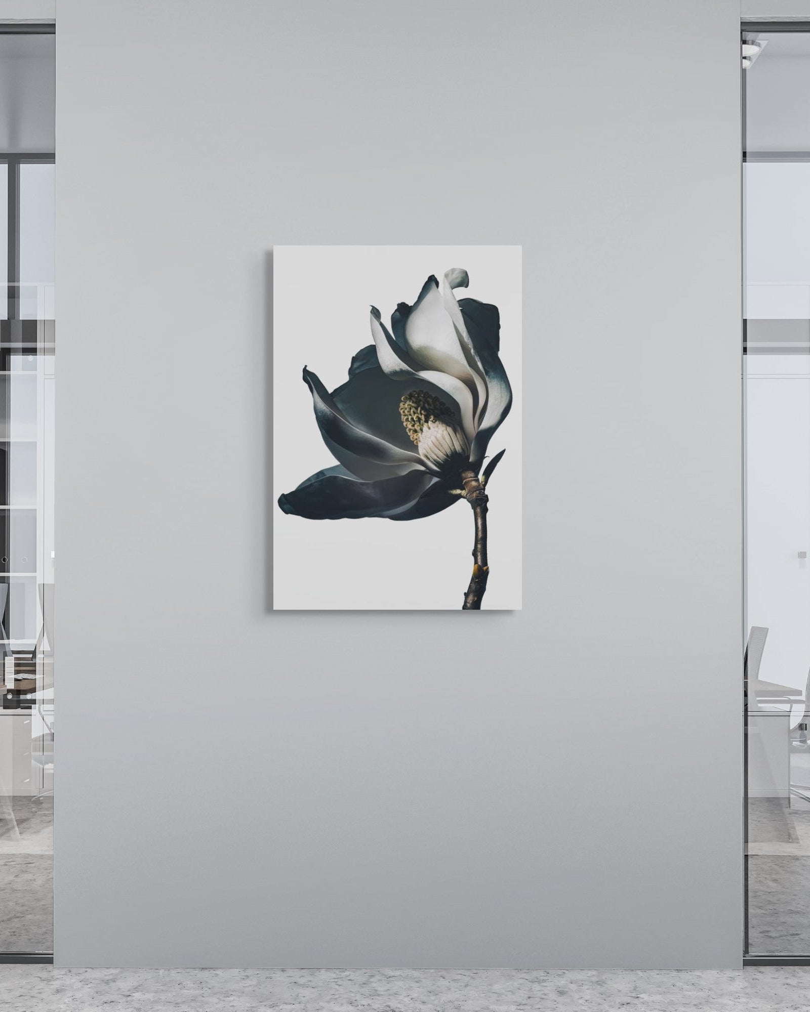 Modern office interior with a large flower print on a gray wall.