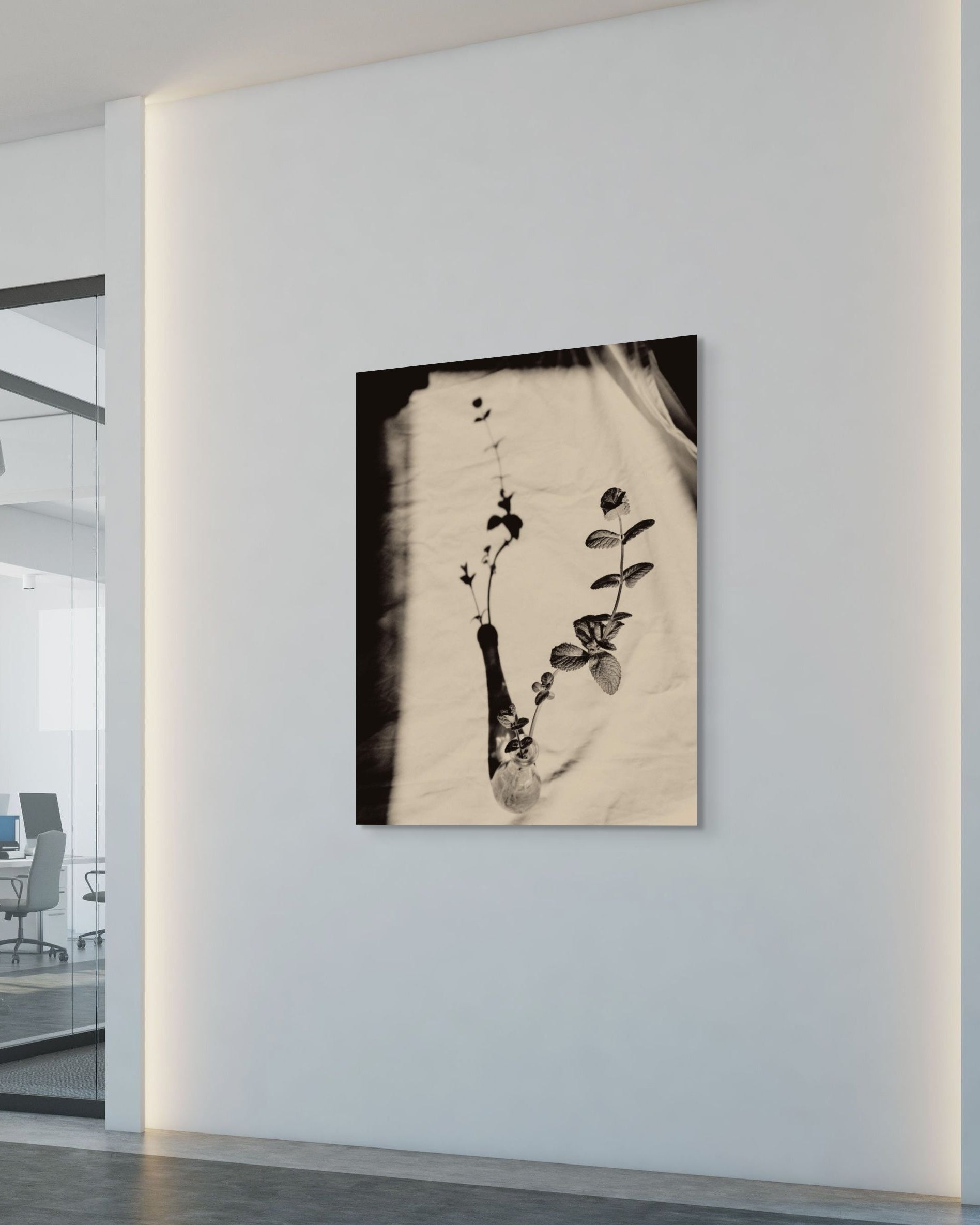 Artistic depiction of a plant on a textured background in a modern office setting