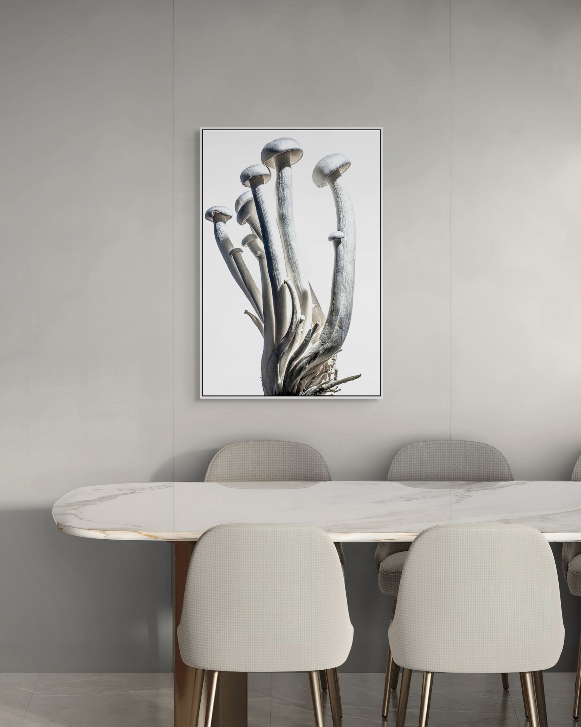 Dining room with a marble table and chairs, featuring a framed artwork on the wall.