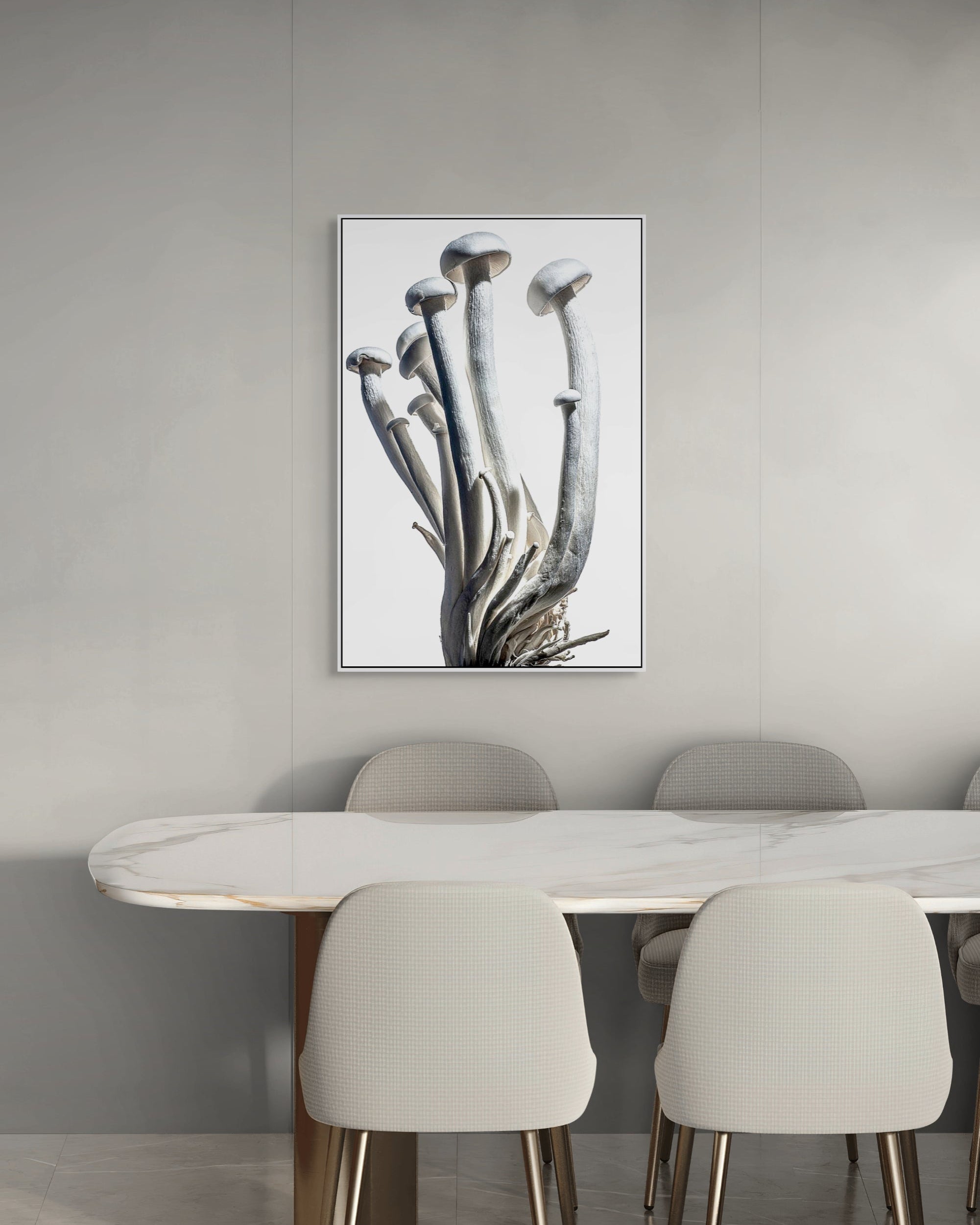 Dining room with a marble table and chairs, featuring a framed artwork on the wall.