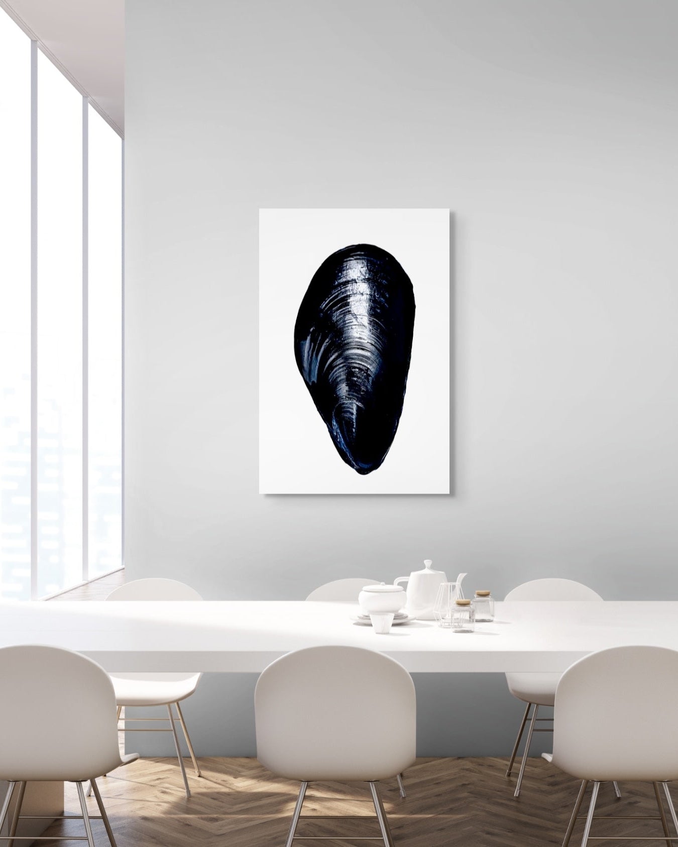 Mussel shell artwork on a wall above a dining table with chairs.