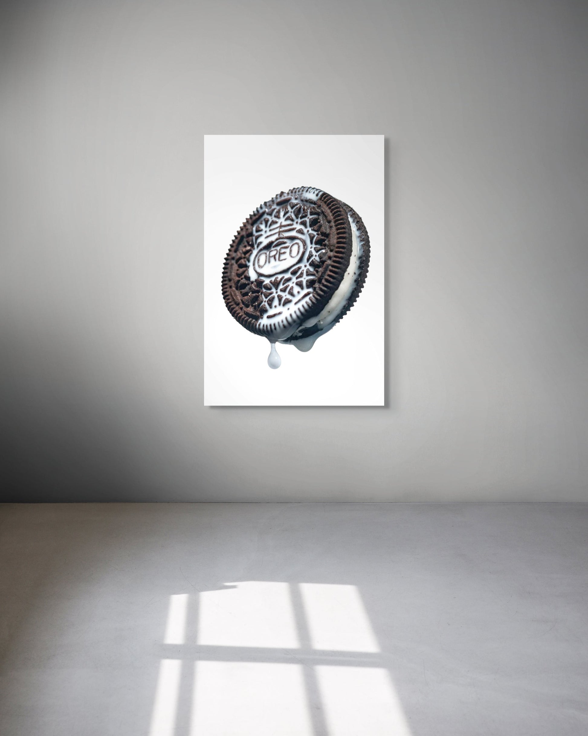 Framed artwork of a Oreo cookie on a white background