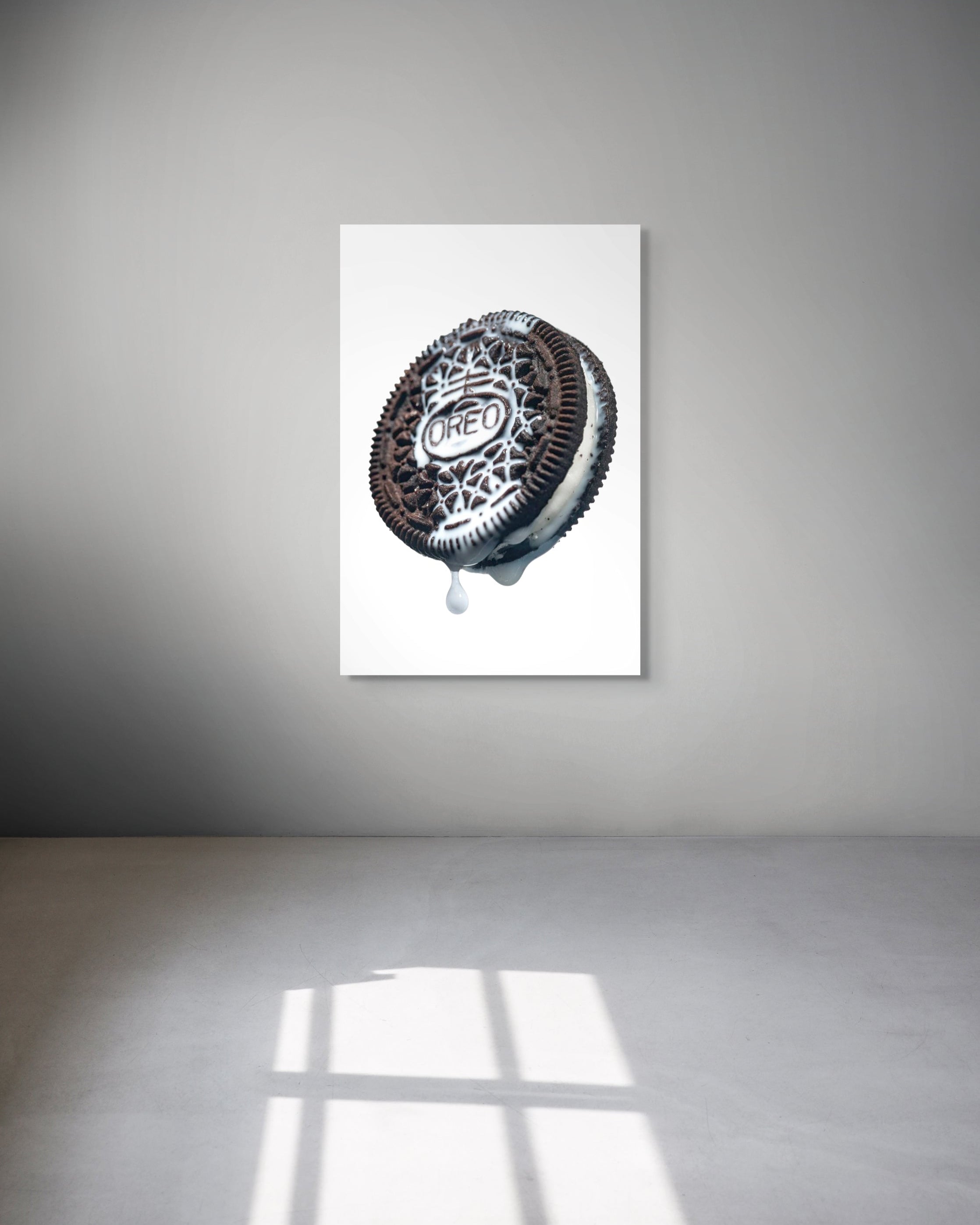 Framed artwork of a Oreo cookie on a white background