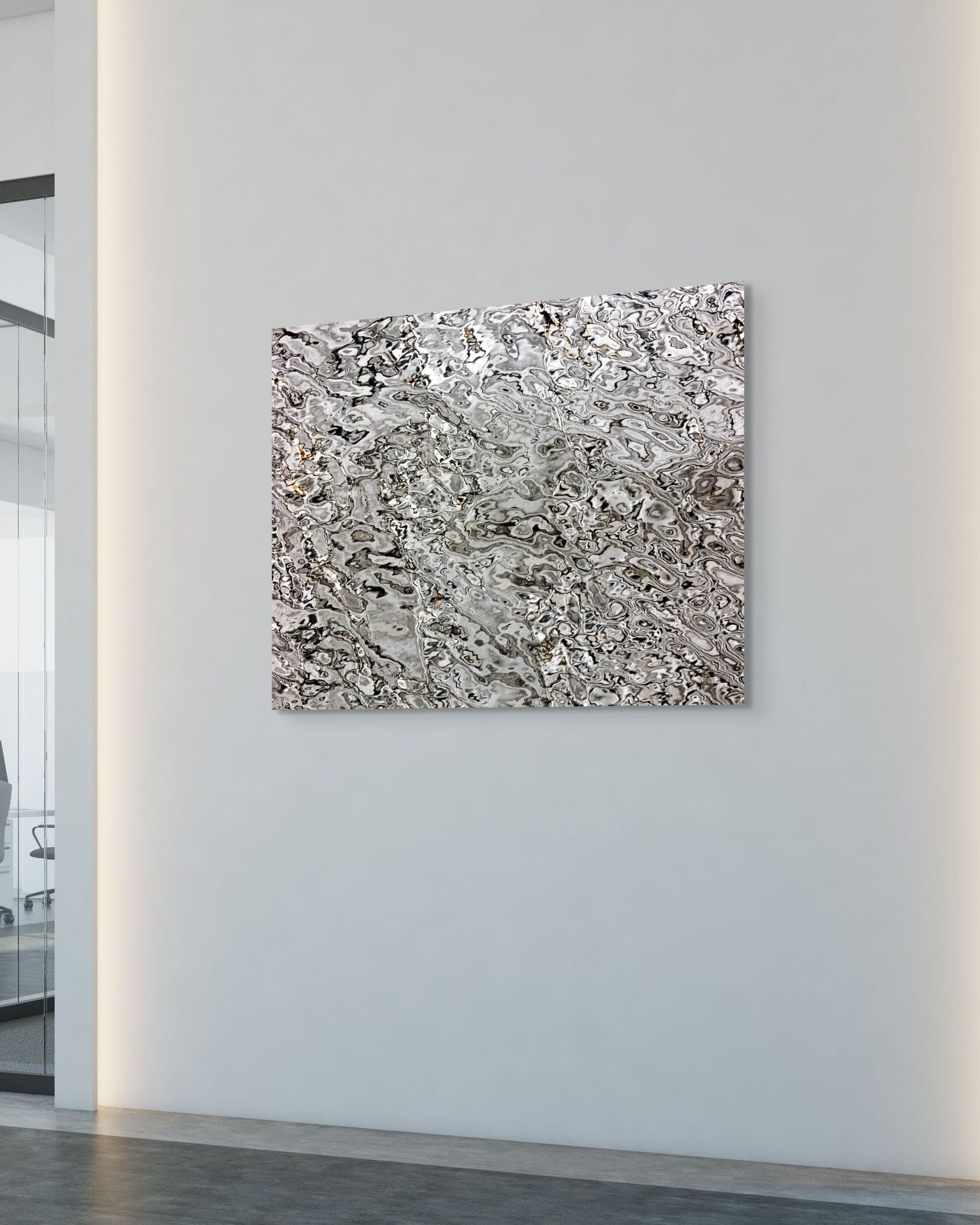 Abstract metal art piece on a wall in an office setting