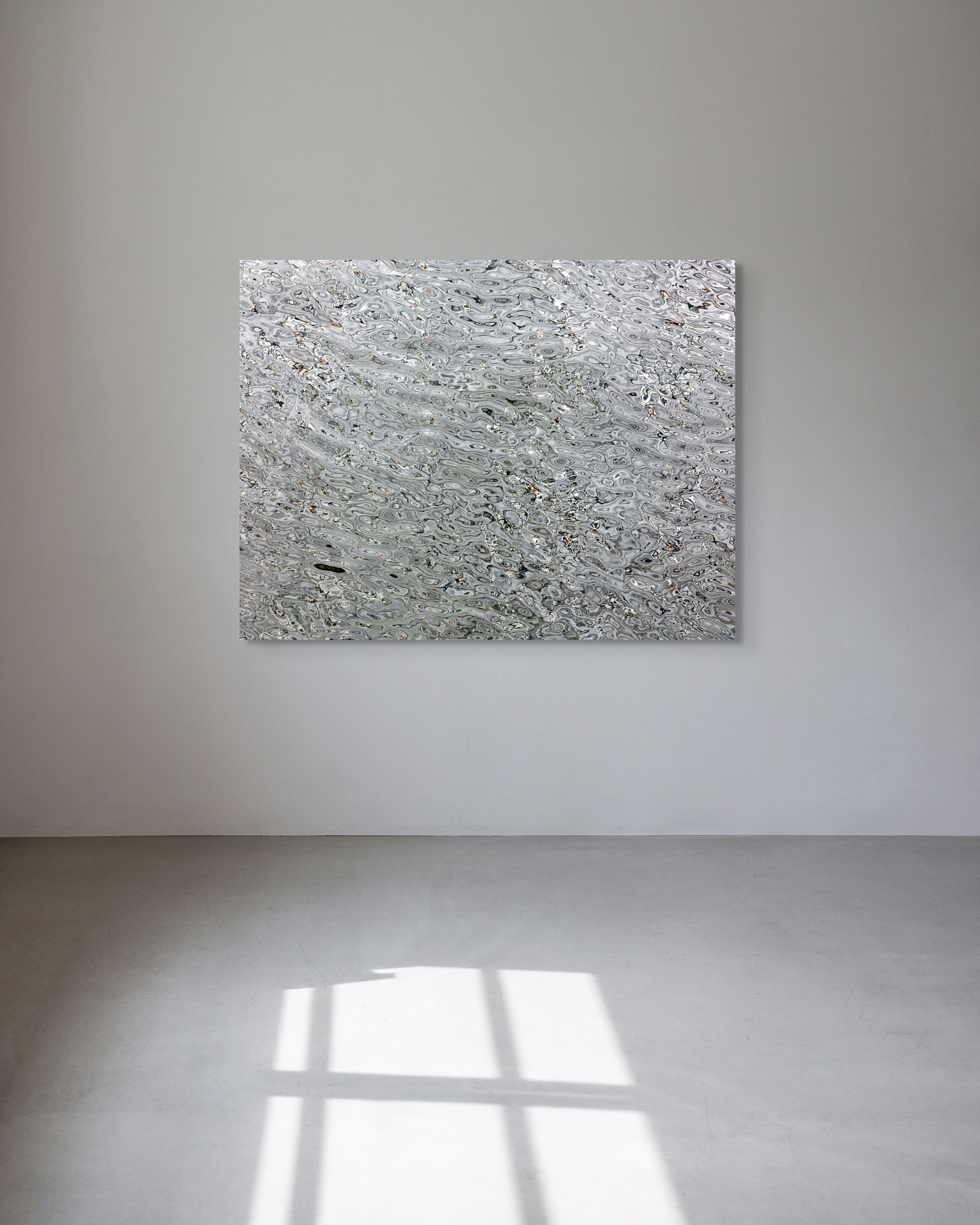 Abstract metal print on a white wall