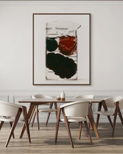 Prep! III by Oscar Calleja — minimalist fine art photograph of a glass beaker with berries, framed in dark walnut on a warm white wall above a walnut table and cream chairs. Limited edition print, exclusive to ART AT HOME.