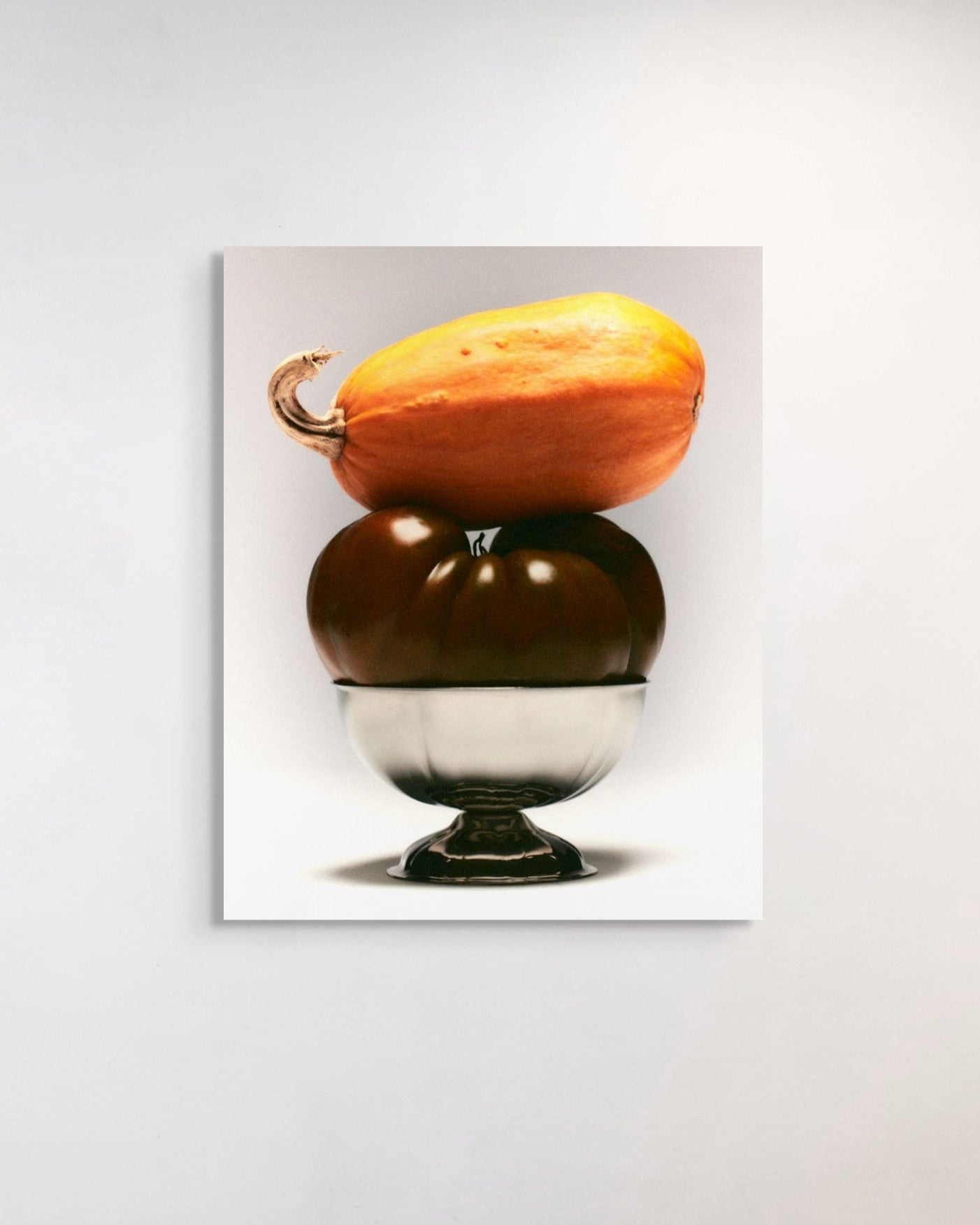 Two stacked pumpkins on a white background