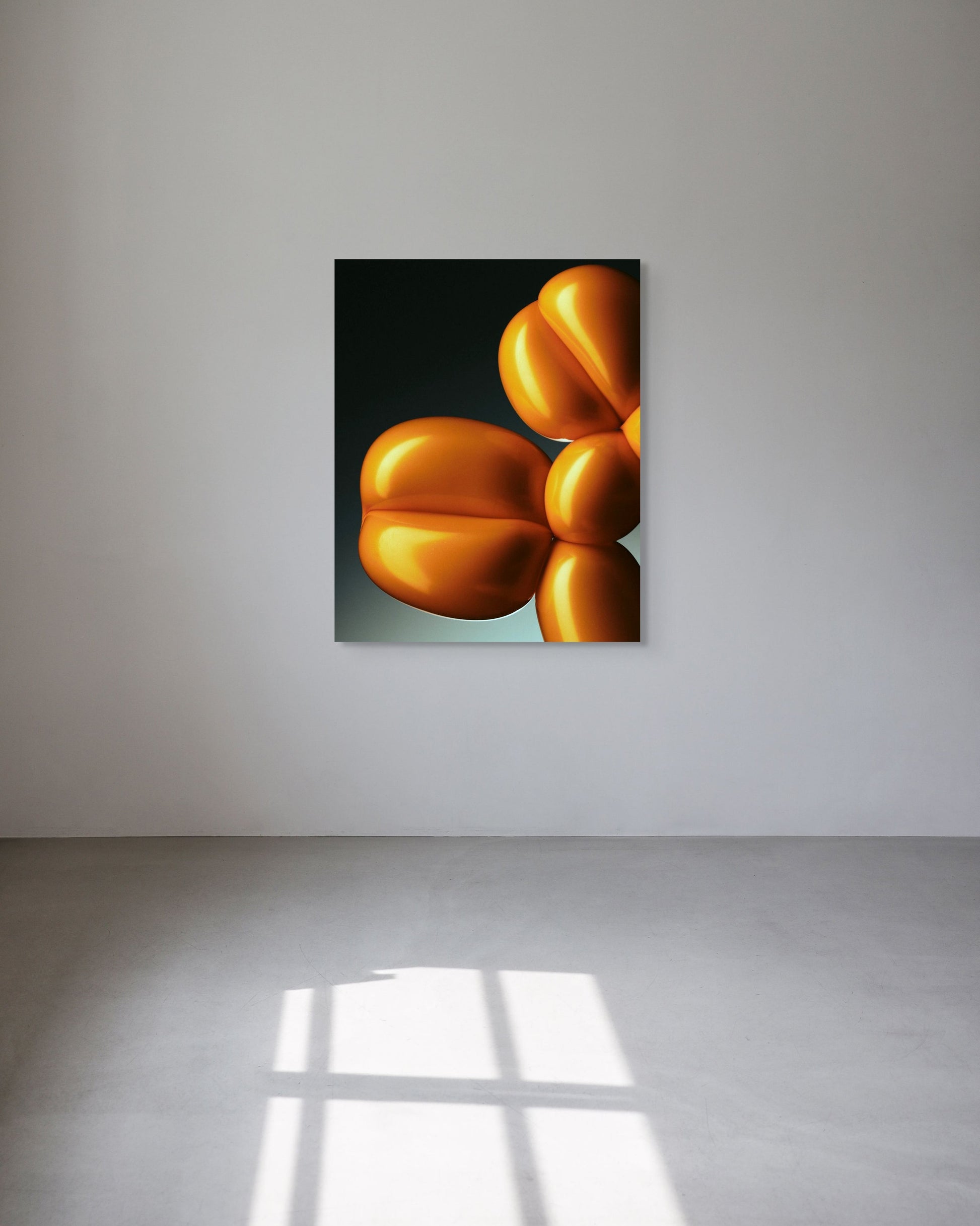 Abstract art of yellow balloons on a gray wall