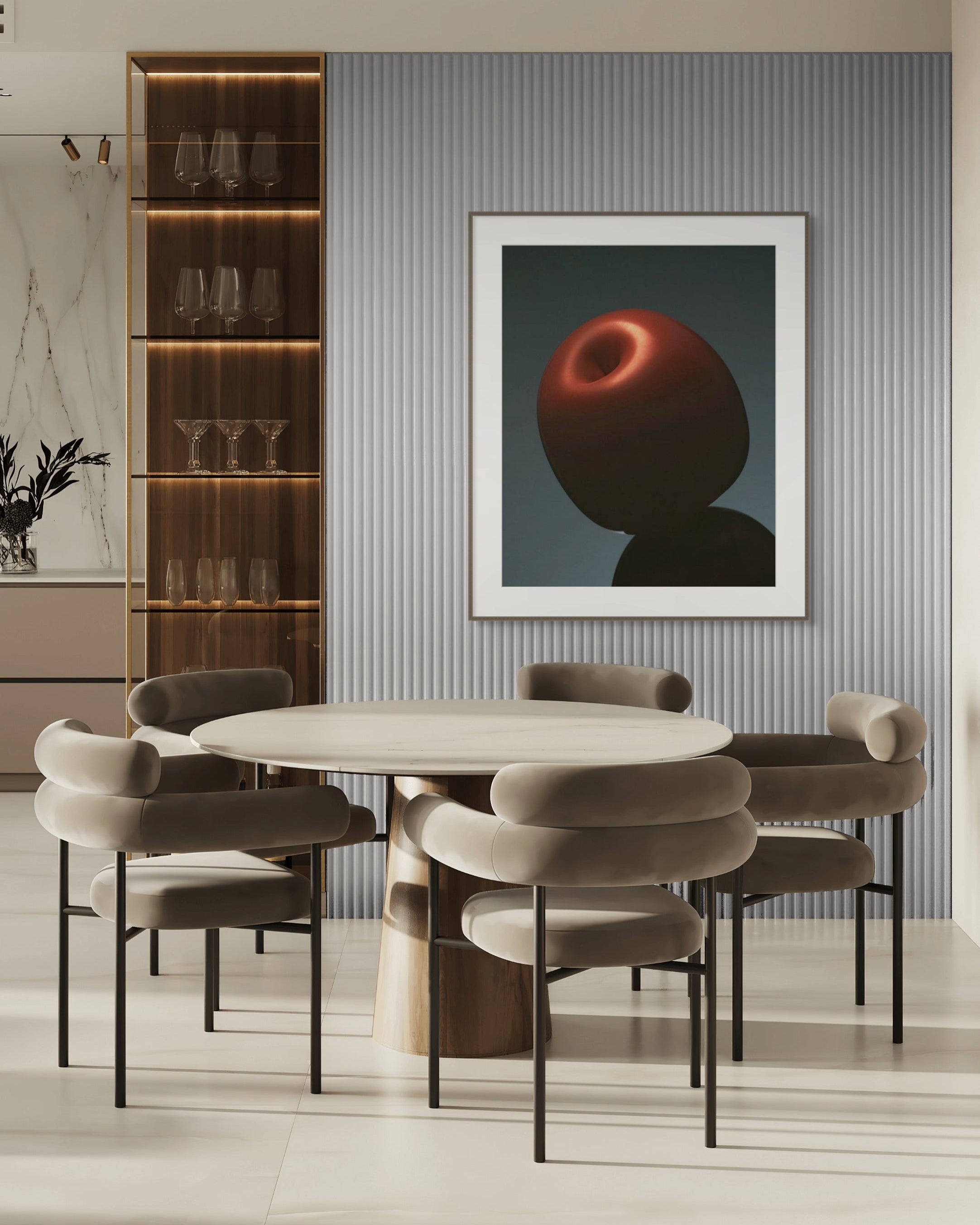 Framed artwork of a red apple still life in a modern dining room with round table and chairs, and shelves.