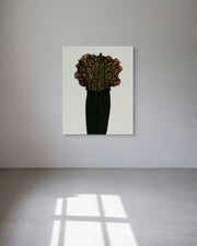 Abstract metal print of a flower-like sculpture on a white wall