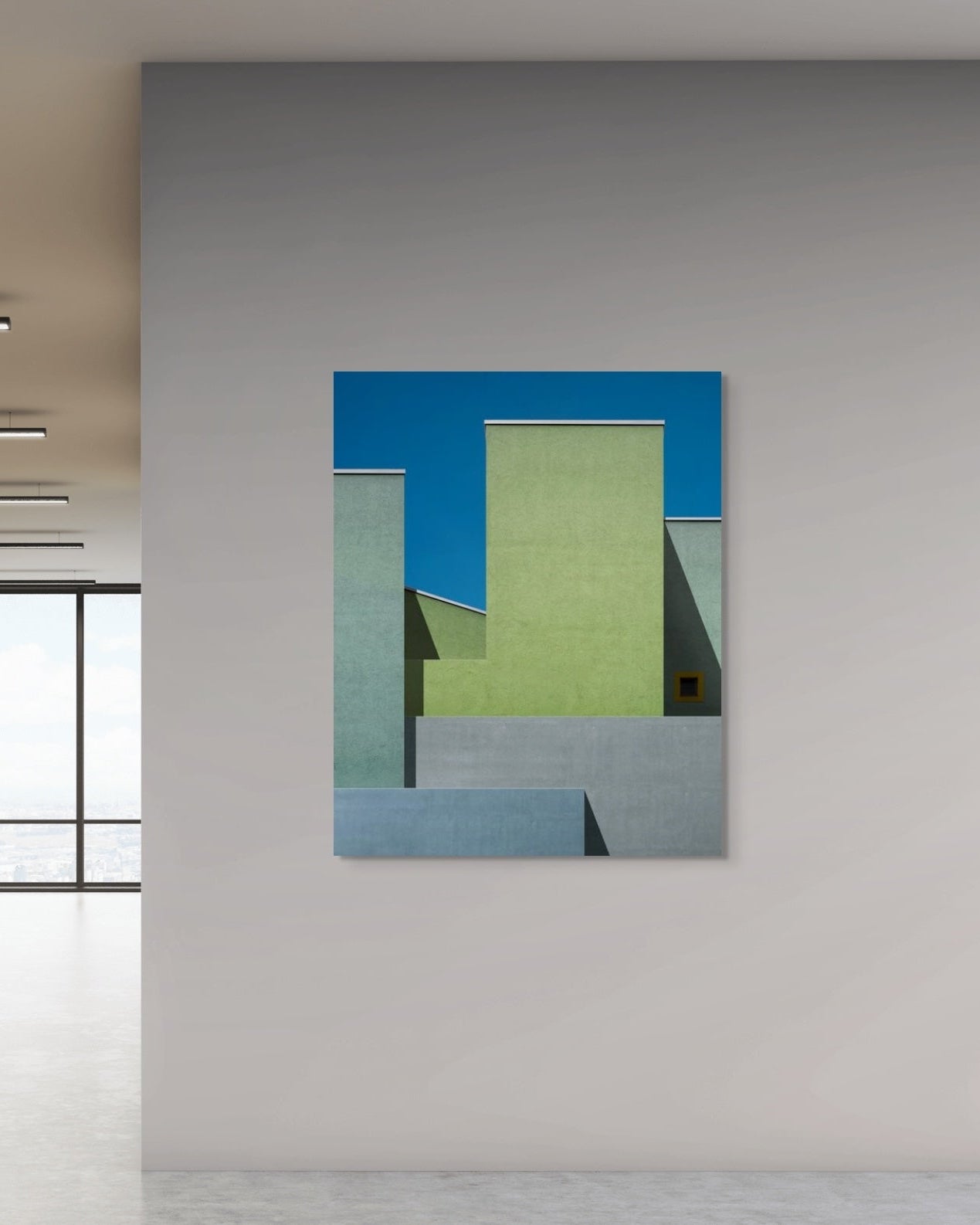 Abstract art piece with geometric shapes on a wall in a modern interior setting