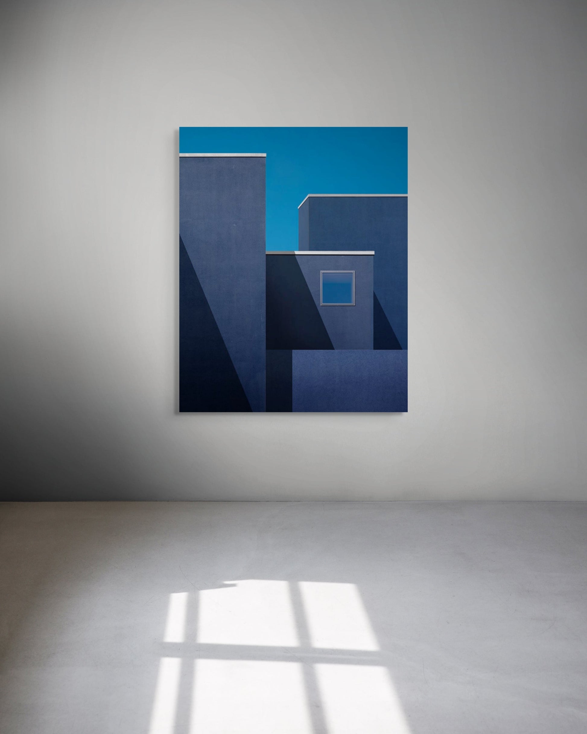 Abstract blue metal print on a white wall