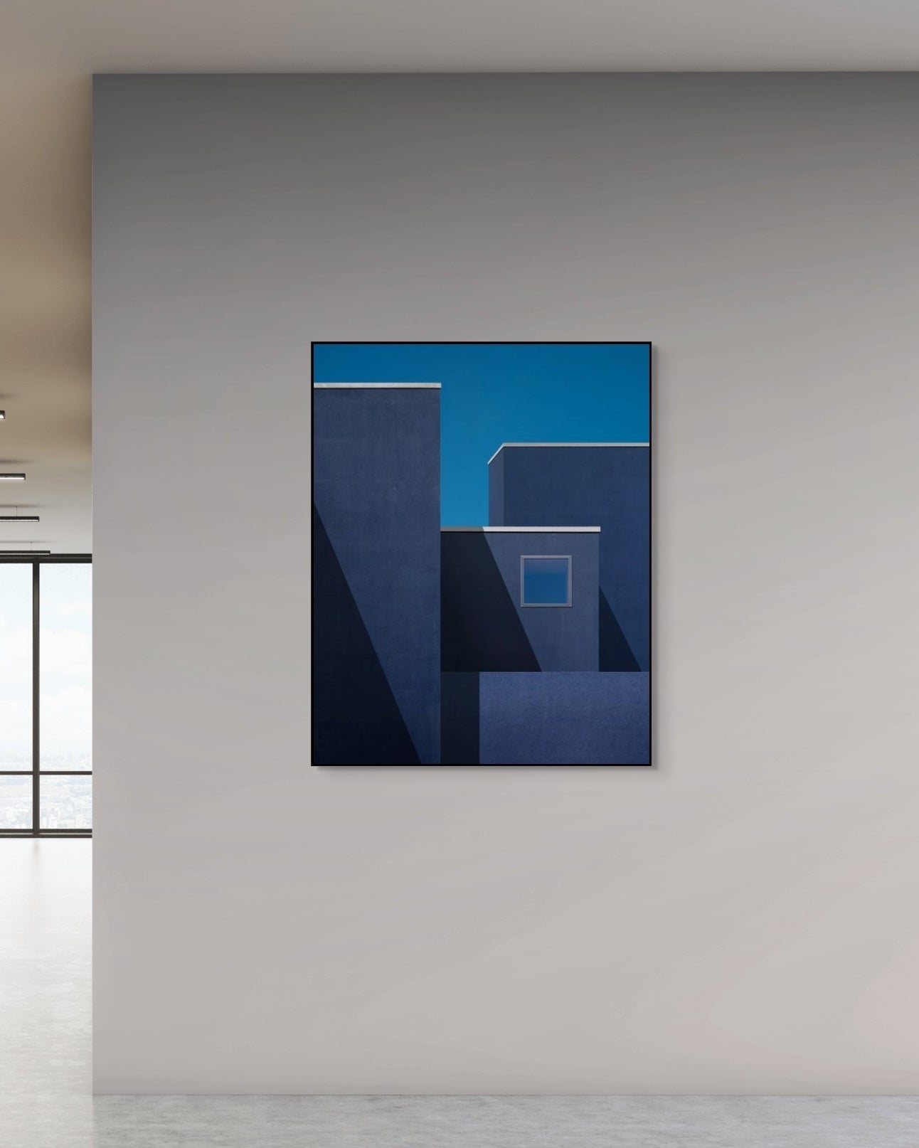 Abstract blue artwork on a gray wall