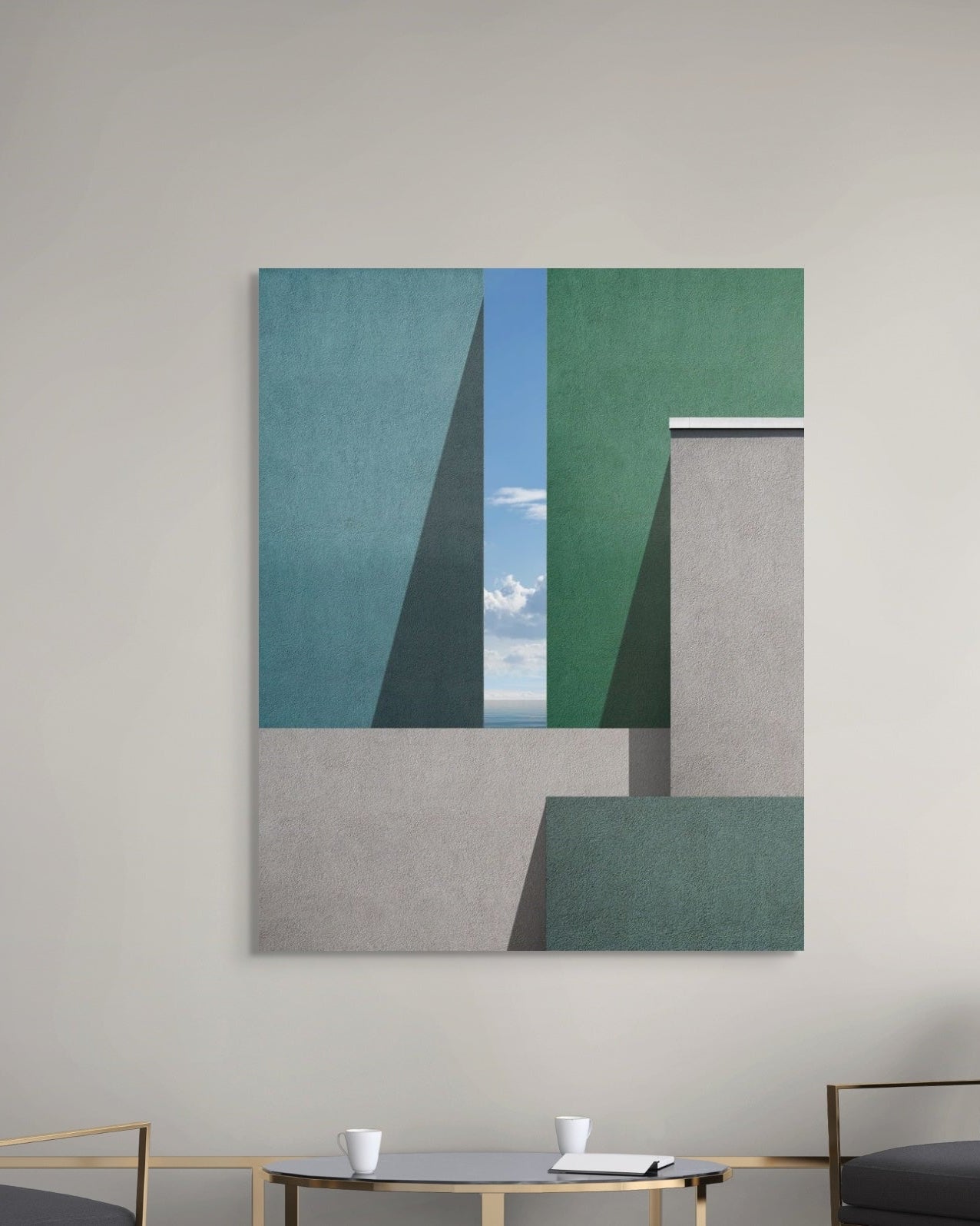 Architectural metal print on a wall with a chair and table in the foreground