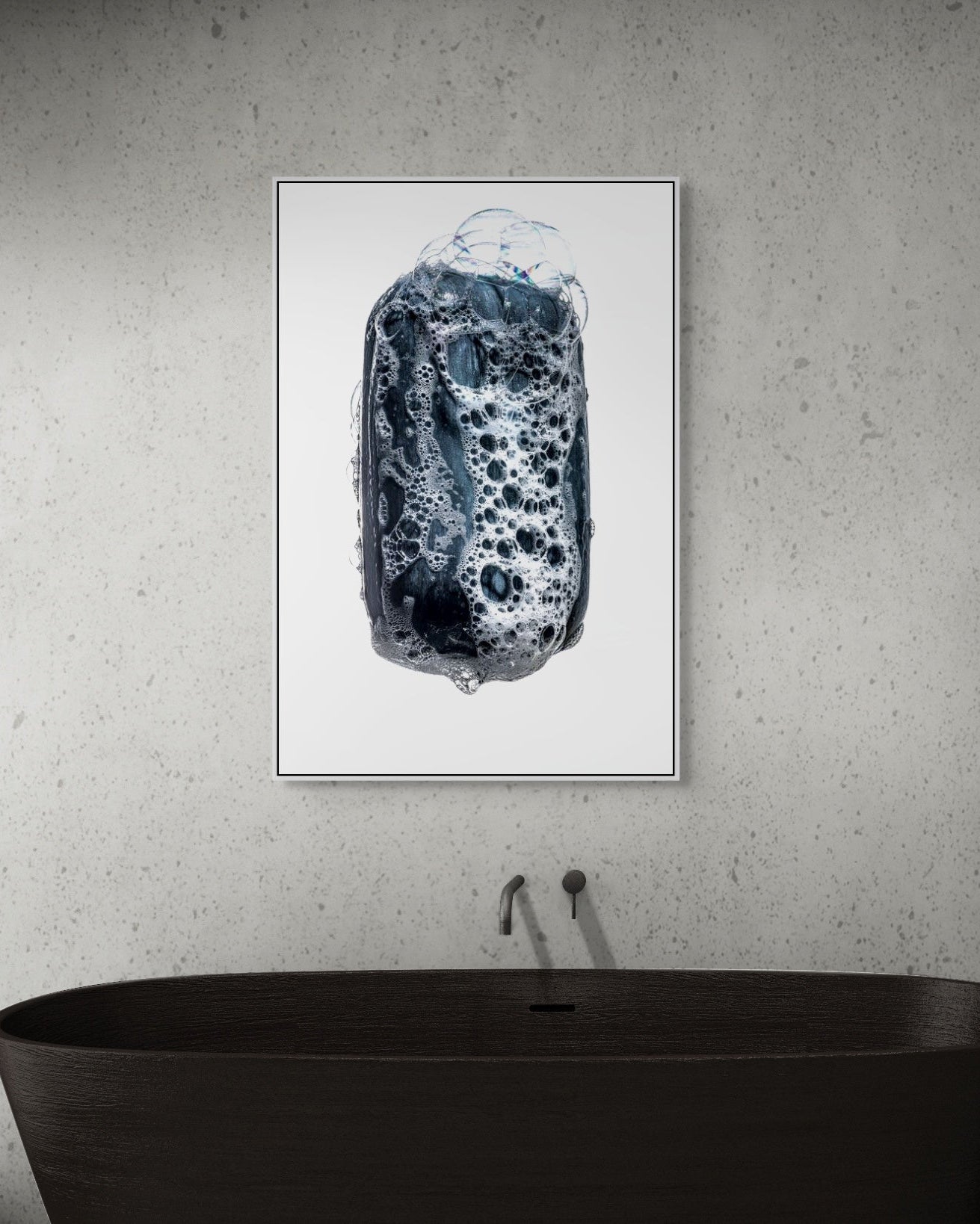 Abstract metal print on a wall above a black bathtub