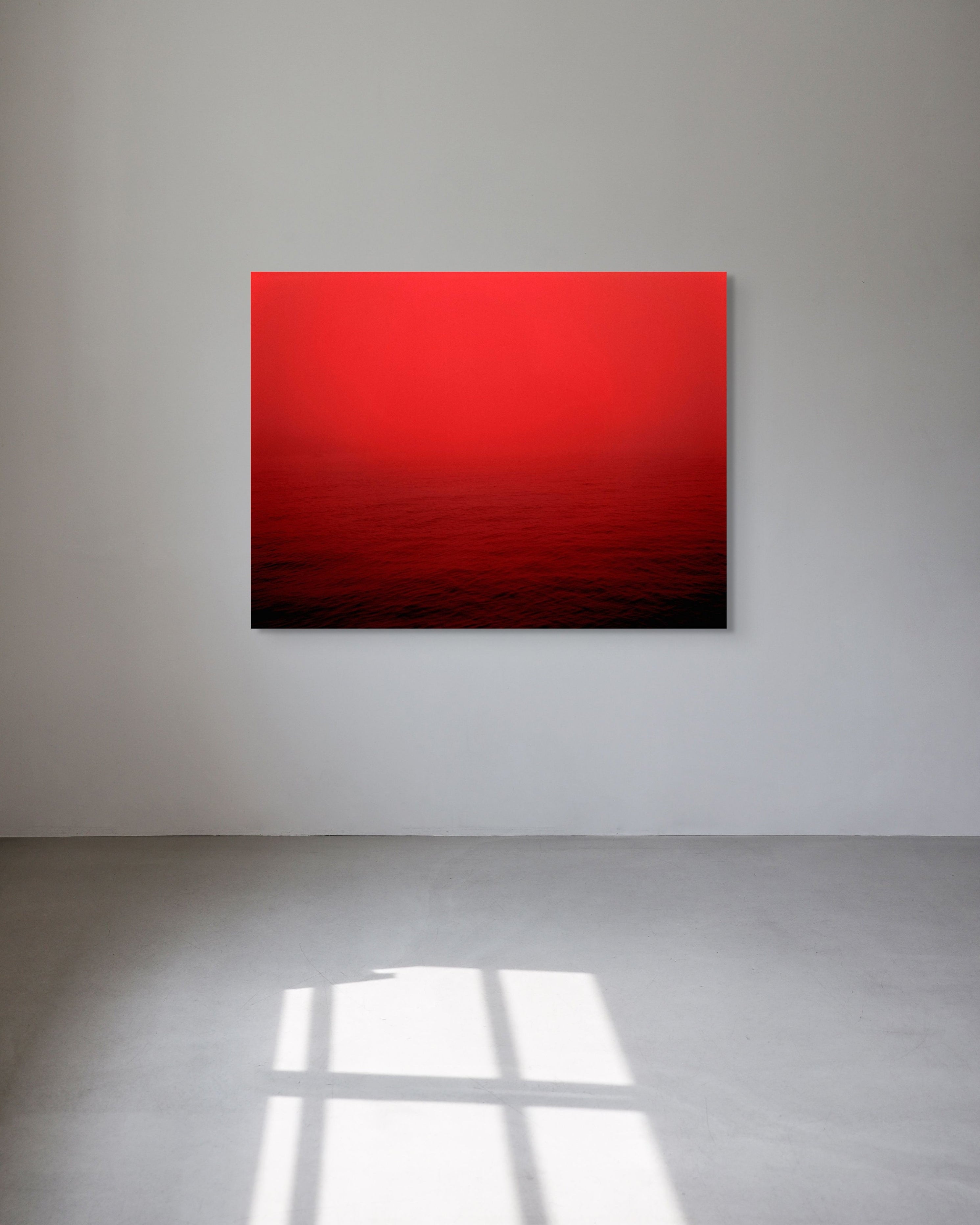 Abstract red metal print on a white wall