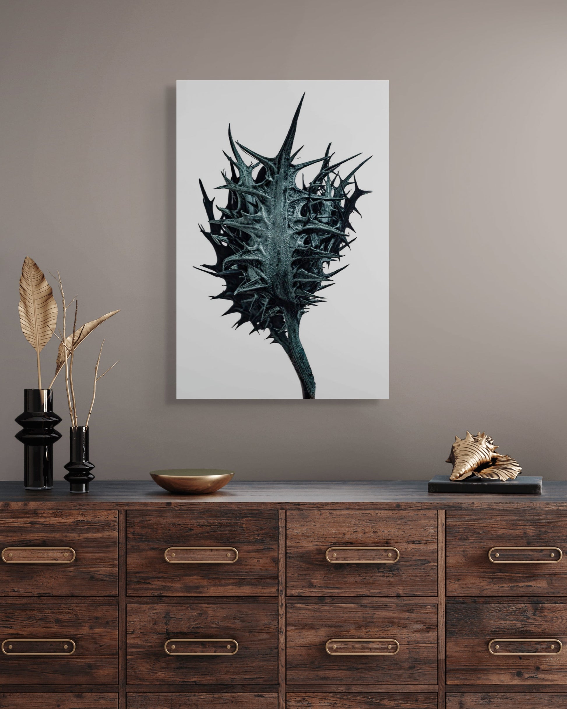 Framed black and white fine art print, Thorn by Sivan Roshianu, ready to hang metal print on a gray wall above a wooden dresser.